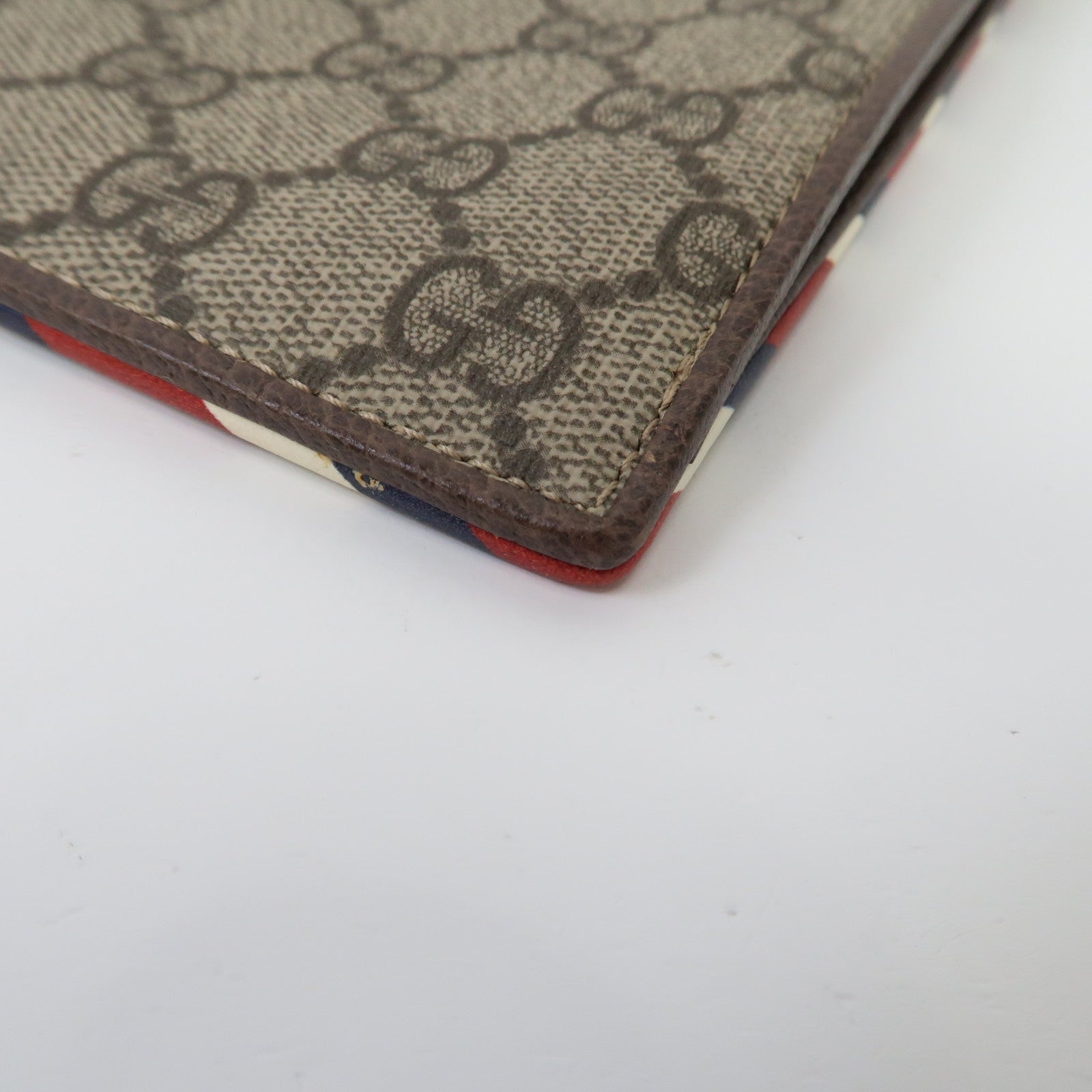 GUCCI 塗層帆布GG Supreme Clutch Bag金扣手拿包啡色