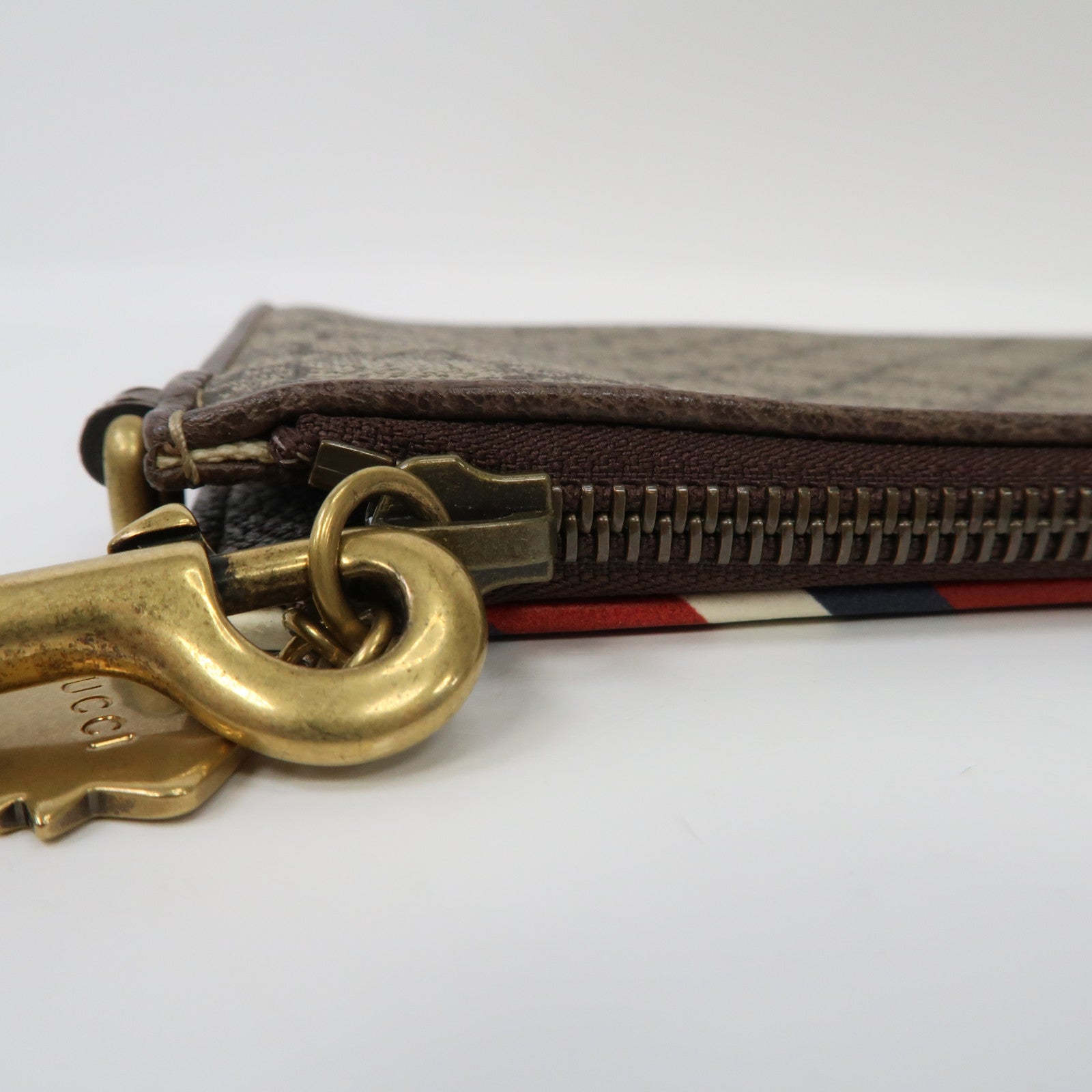 GUCCI 塗層帆布GG Supreme Clutch Bag金扣手拿包啡色