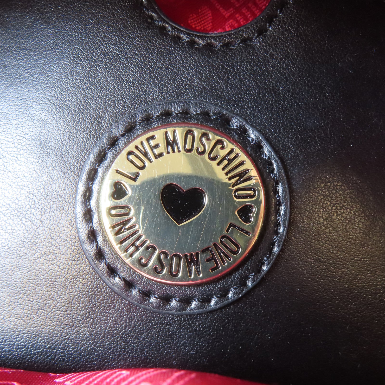 MOSCHINO 菱格塗層帆布Backpack金扣背包黑色