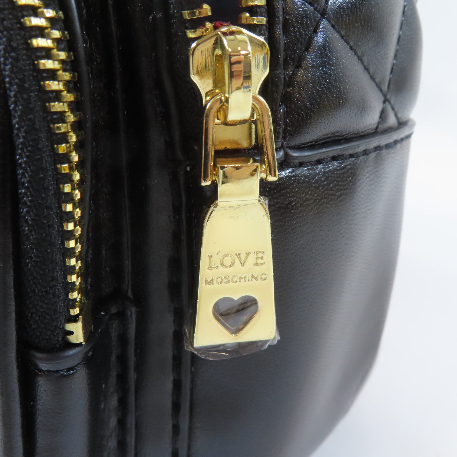 MOSCHINO 菱格塗層帆布Backpack金扣背包黑色