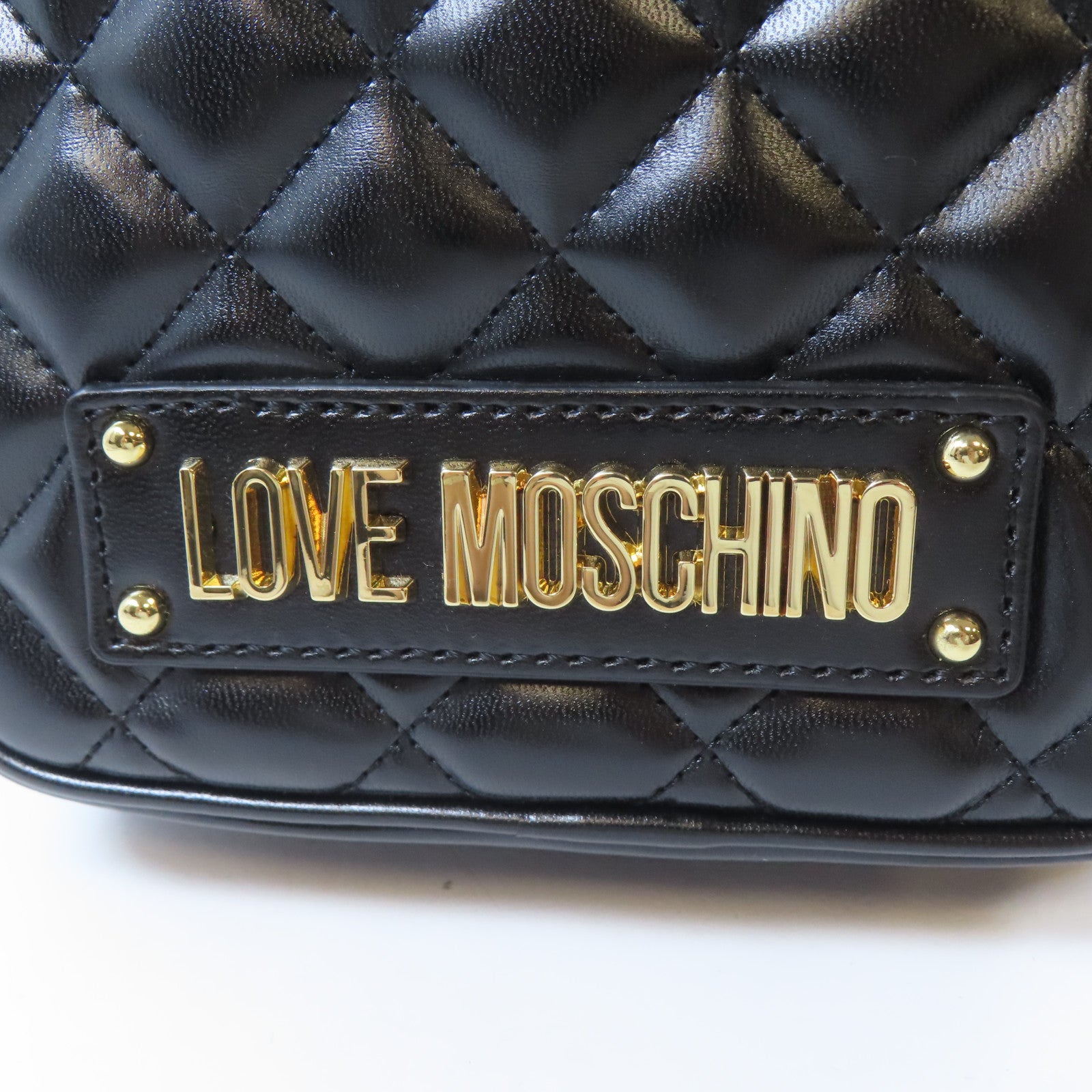 MOSCHINO 菱格塗層帆布Backpack金扣背包黑色