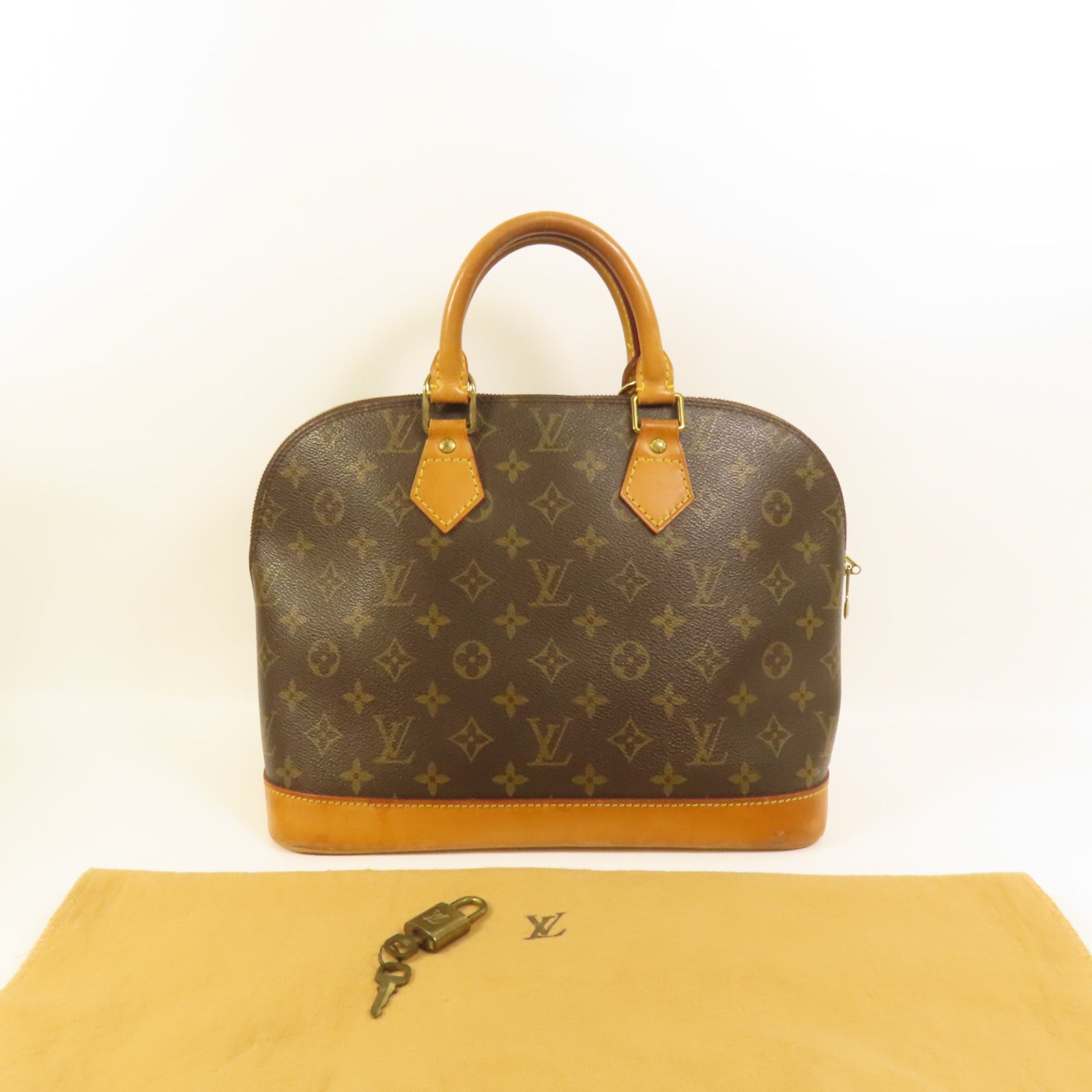LOUIS VUITTON Monogram Alma金扣手挽袋棕色