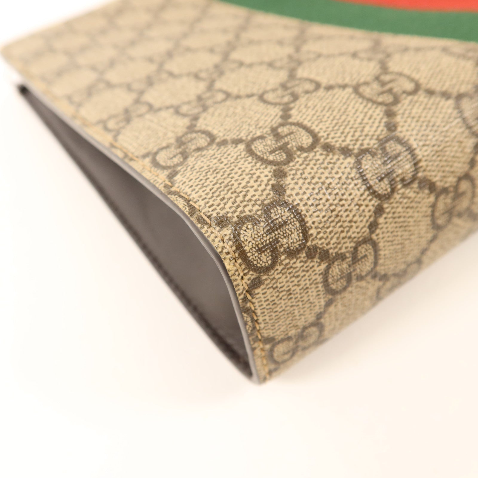 GUCCI 塗層帆布GG Supreme Clutch銀扣手拿包
