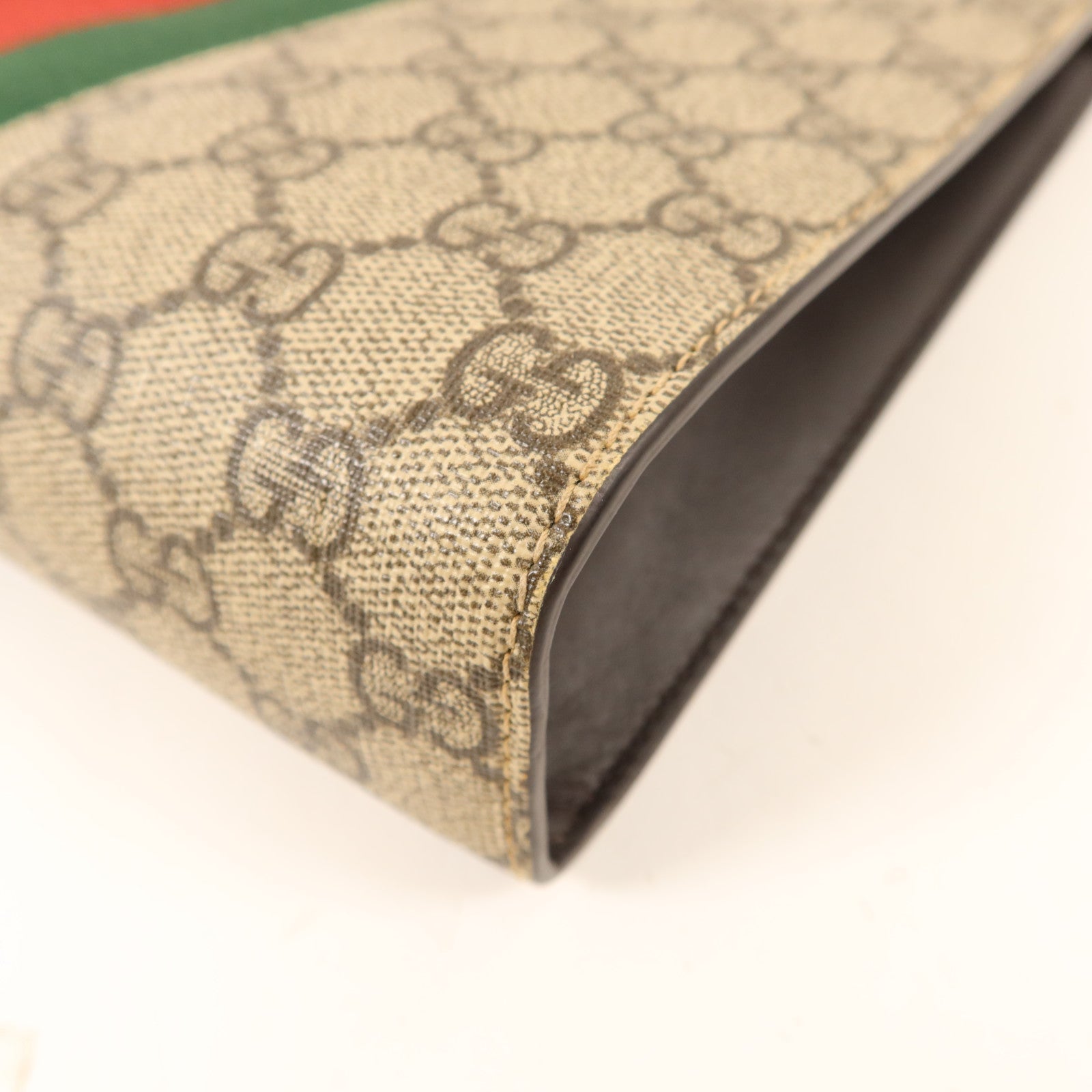 GUCCI 塗層帆布GG Supreme Clutch銀扣手拿包