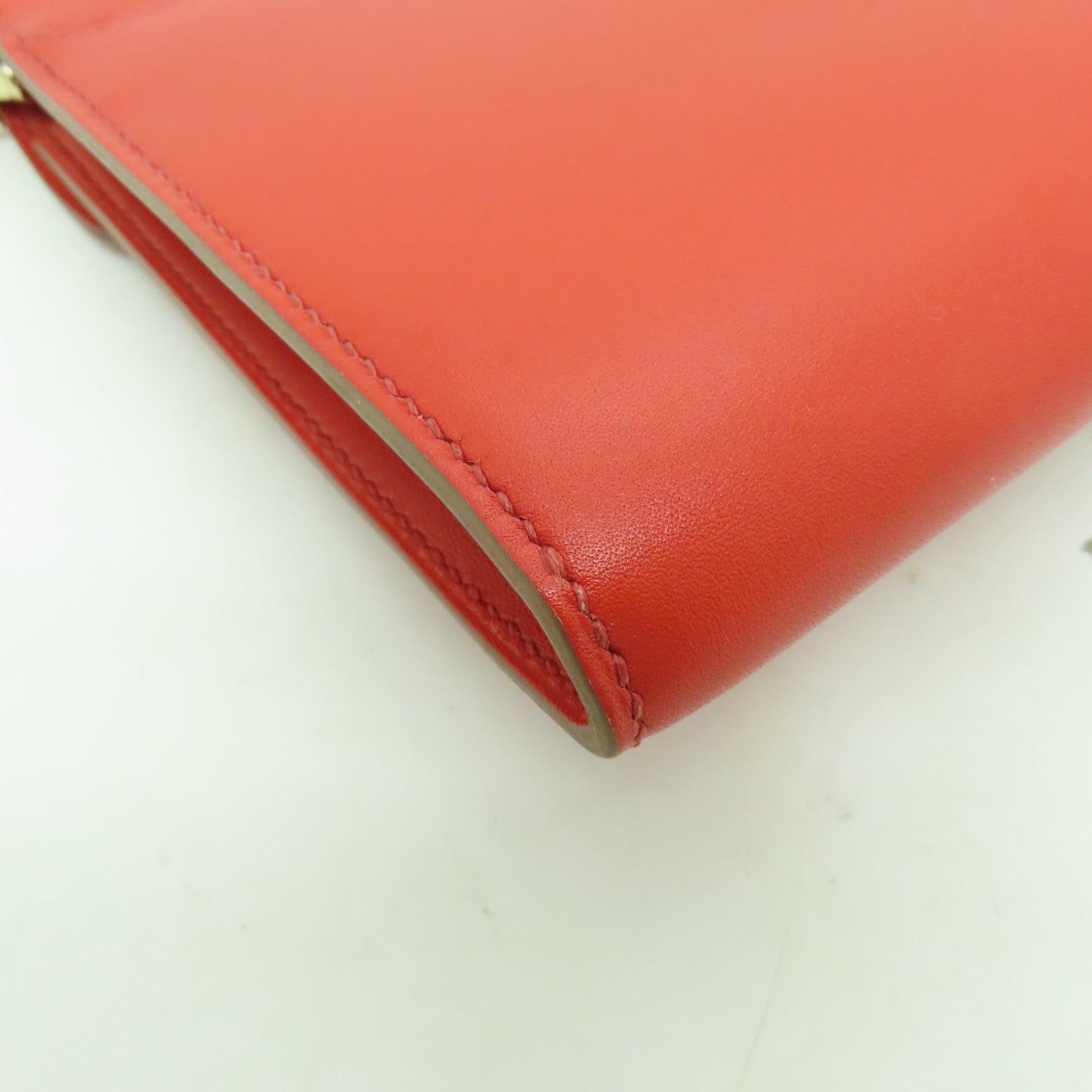 HERMES 【激減優惠】Tadelakt皮革Sac Rock Clutch金扣手拿包Capucine紅色