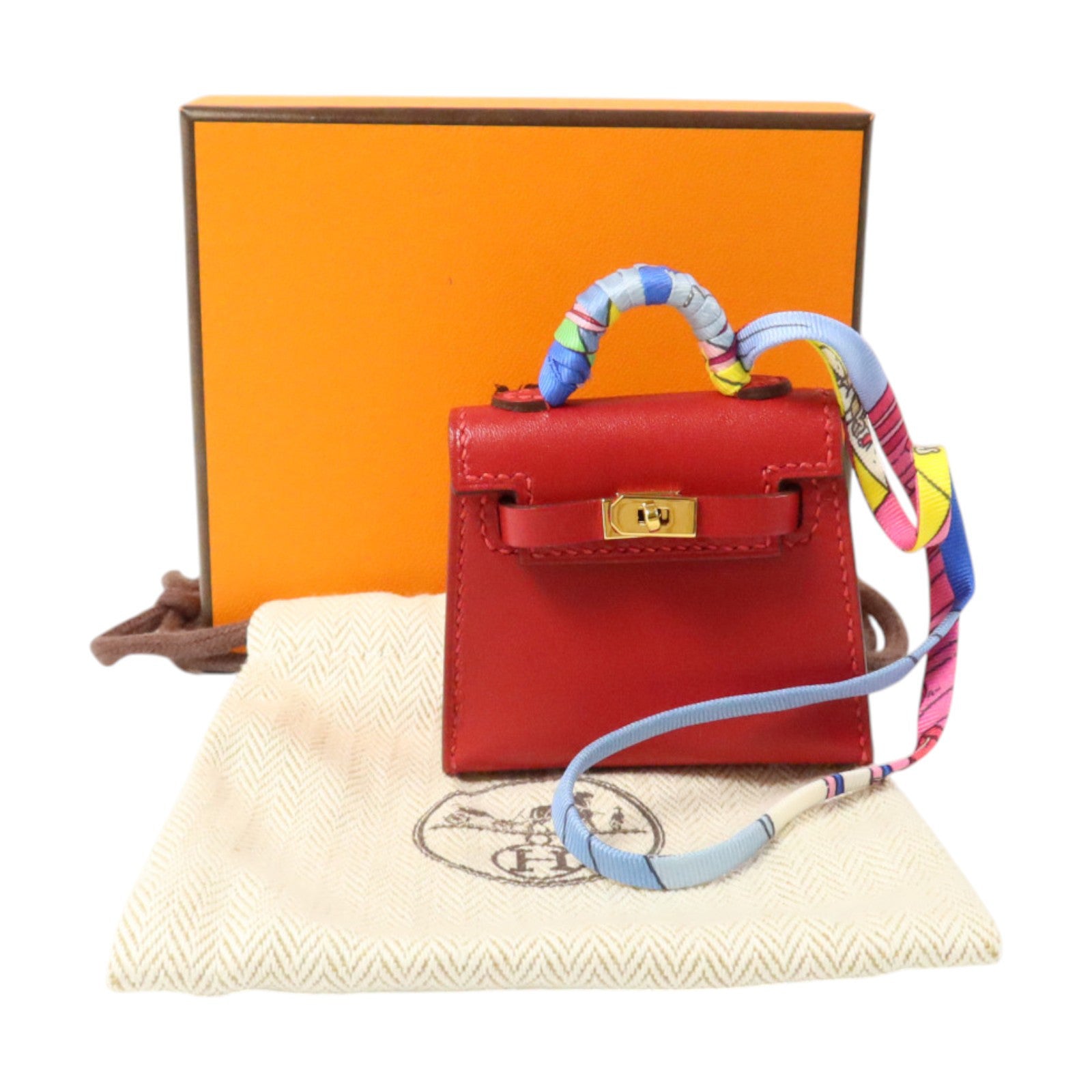 HERMES Tadelakt皮革/絲質Mini Kelly Twilly Bag Charm金扣掛飾Rouge Vif