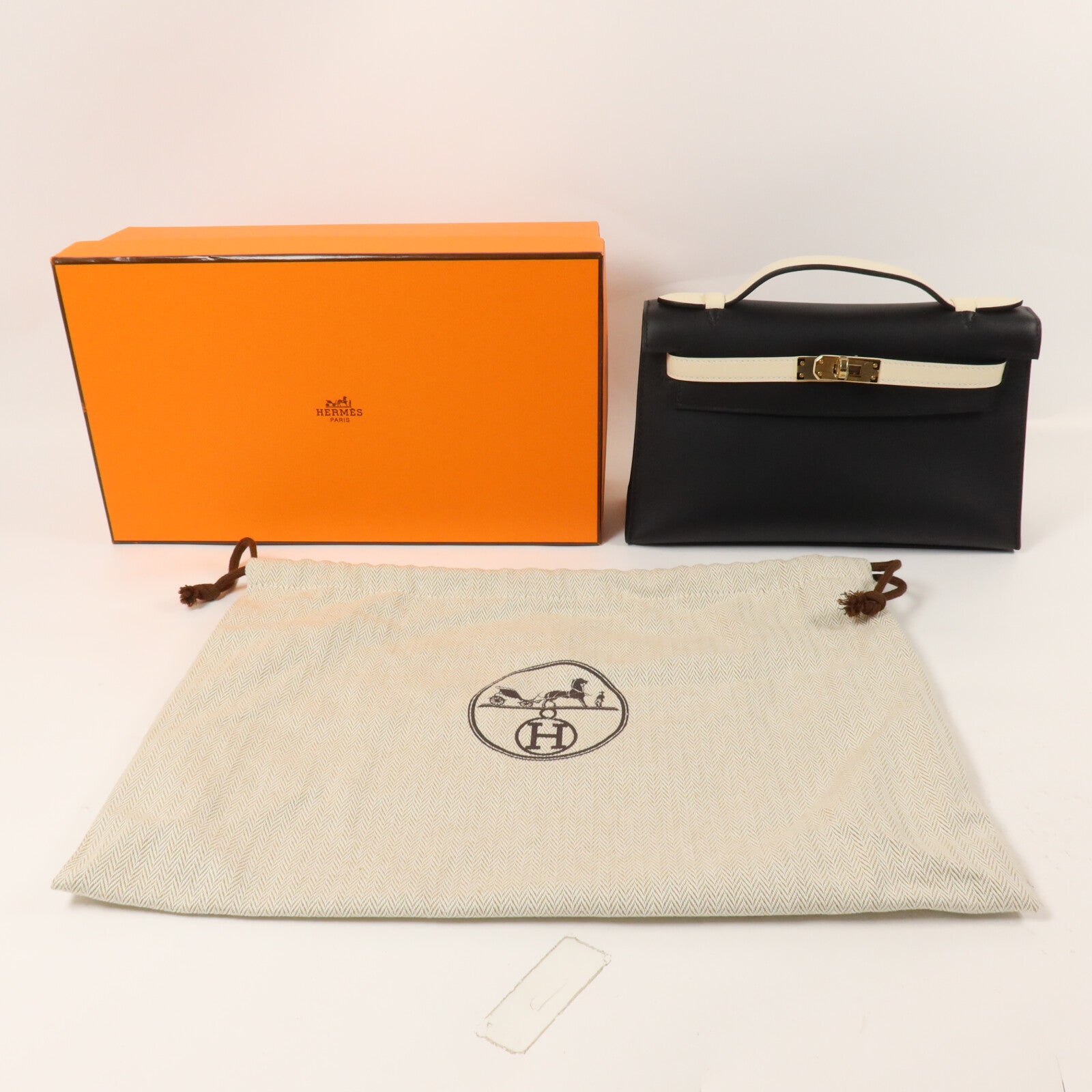 HERMES Swift皮革Kelly Pochette SPO手挽袋Noir/Craie