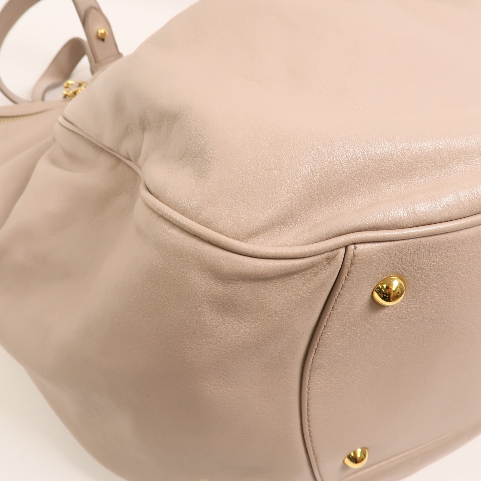 Miu Miu 牛皮皮革Vitello Lux Hobo金扣手挽袋