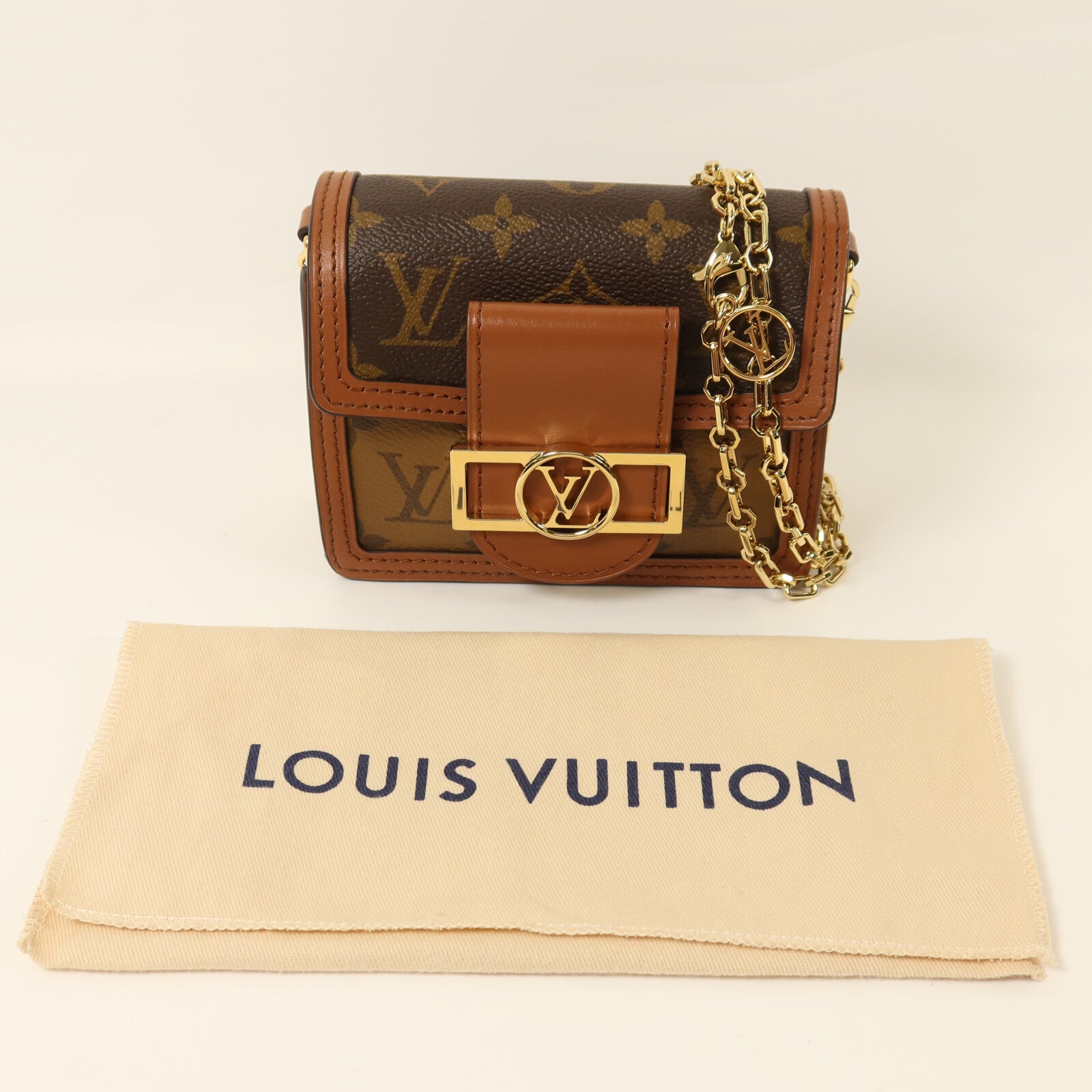 LOUIS VUITTON Monogram/Monogram Reverse Micro Dauphine金扣鏈帶肩背袋棕色