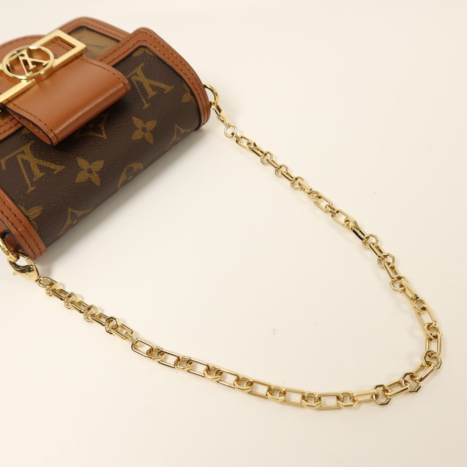 LOUIS VUITTON Monogram/Monogram Reverse Micro Dauphine金扣鏈帶肩背袋棕色