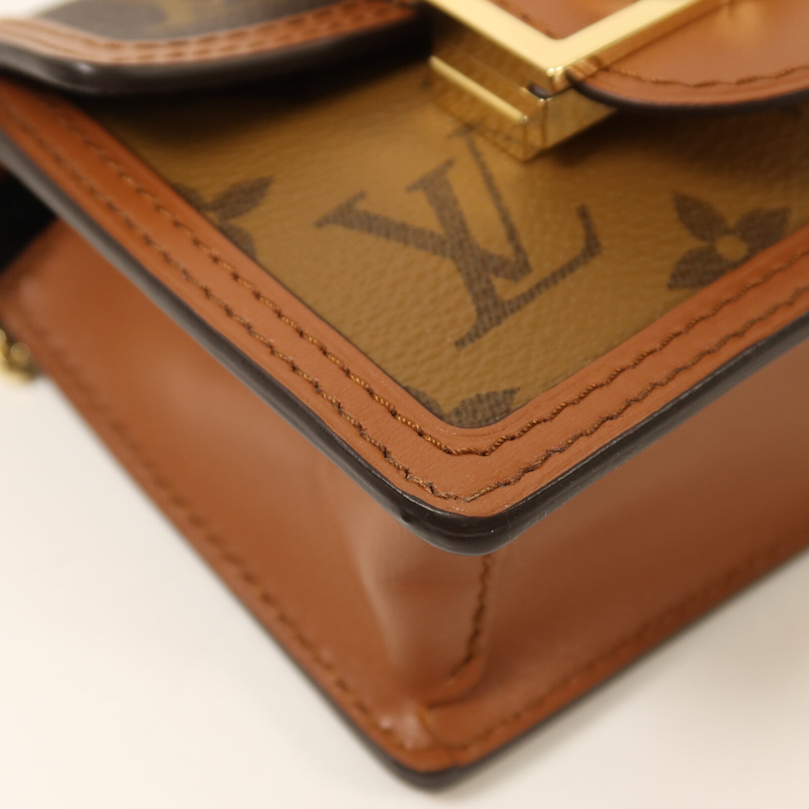 LOUIS VUITTON Monogram/Monogram Reverse Micro Dauphine金扣鏈帶肩背袋棕色