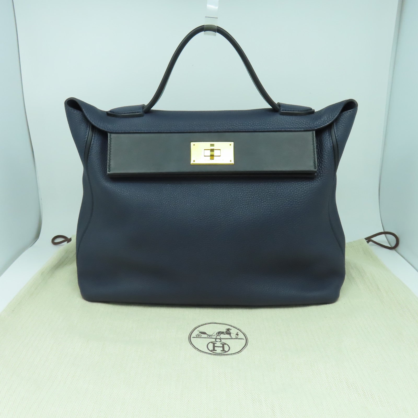 HERMES 【激減優惠】Clemence皮革24/24 35cm金扣手挽袋午夜藍色/黑色