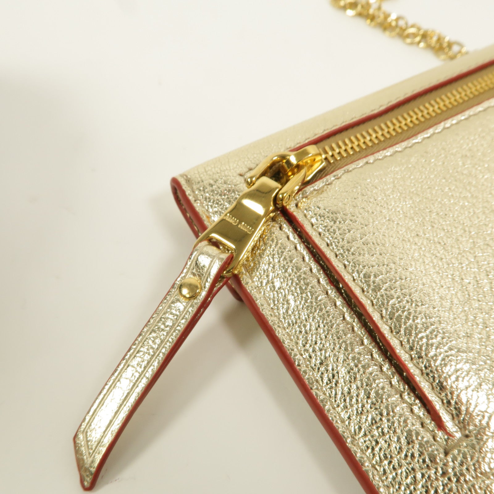 Miu Miu 牛皮皮革Madras Love手拿包