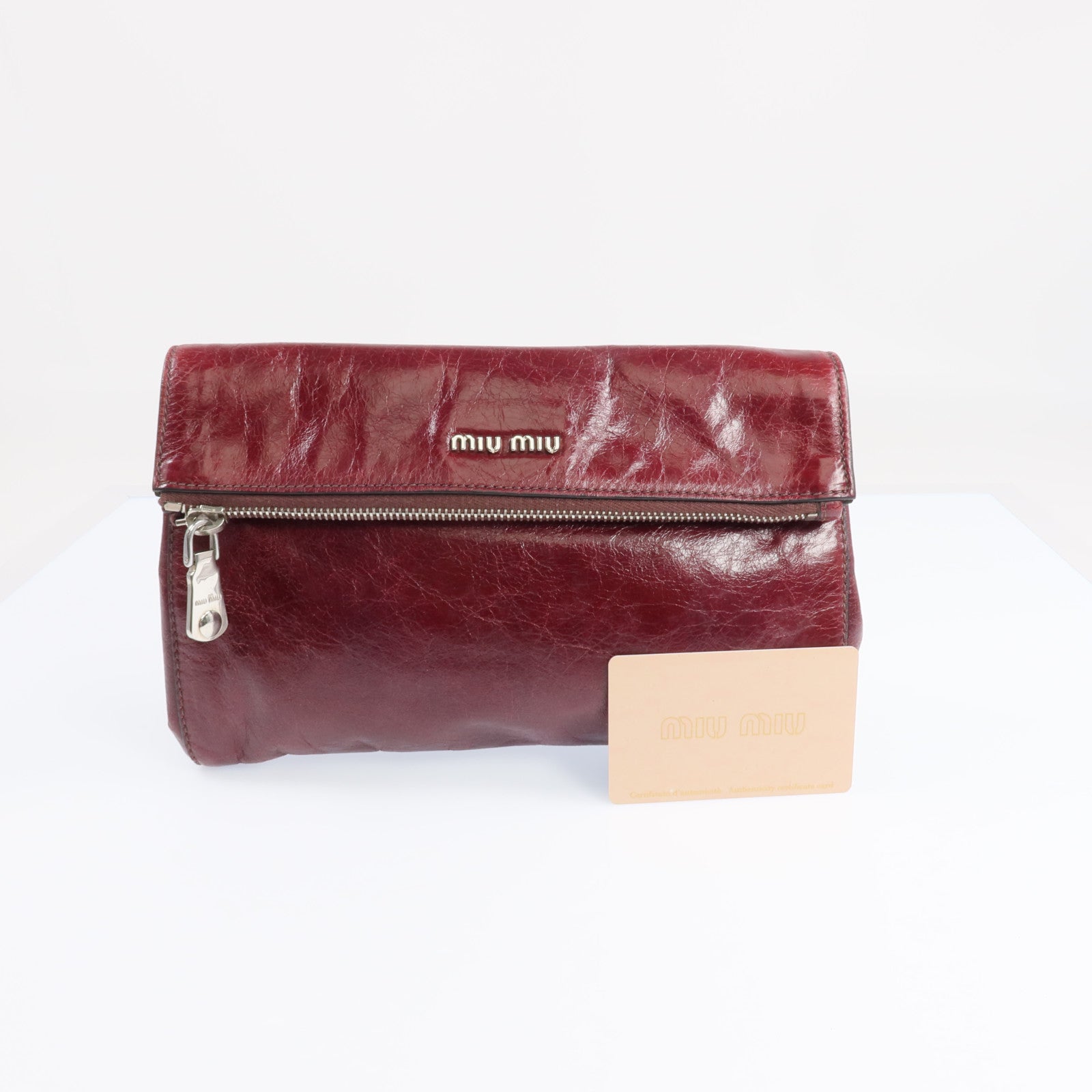 Miu Miu 牛皮皮革Clutch Bag銀扣手拿包