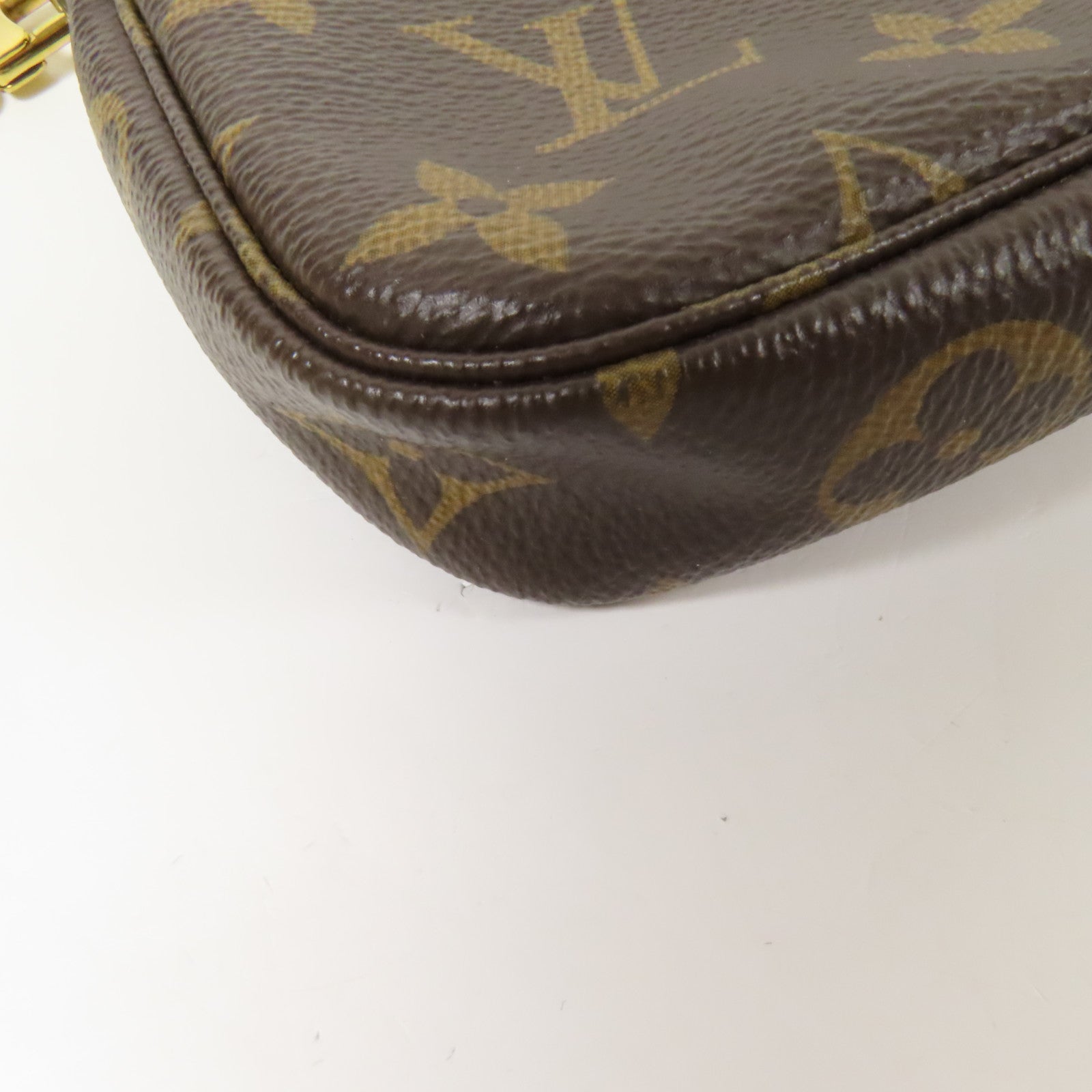 LOUIS VUITTON Monogram Mini Pochette Accessoires金扣手挽袋