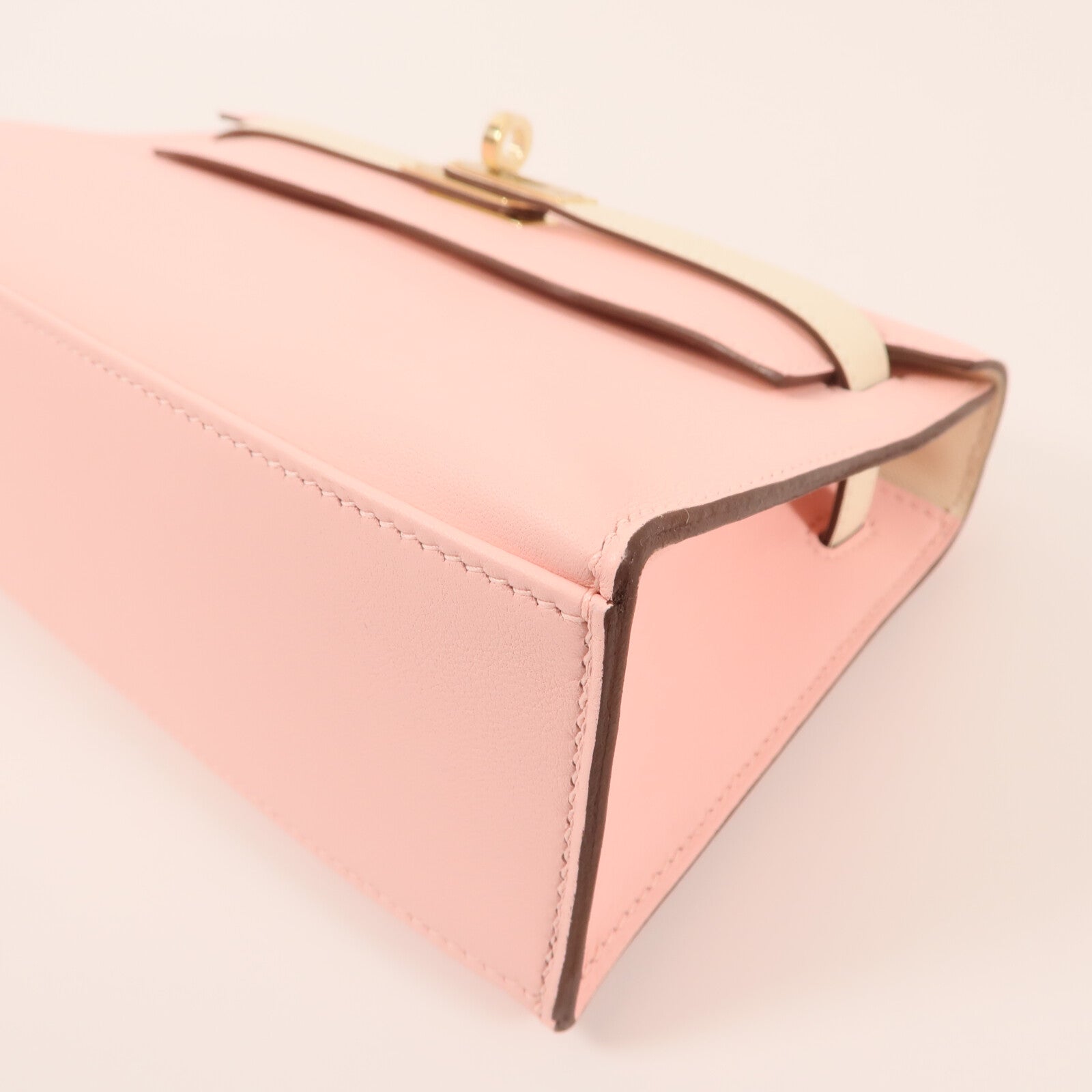 HERMES Swift皮革Mini Kelly Pochette金扣手挽袋Rose Sakura/Nata