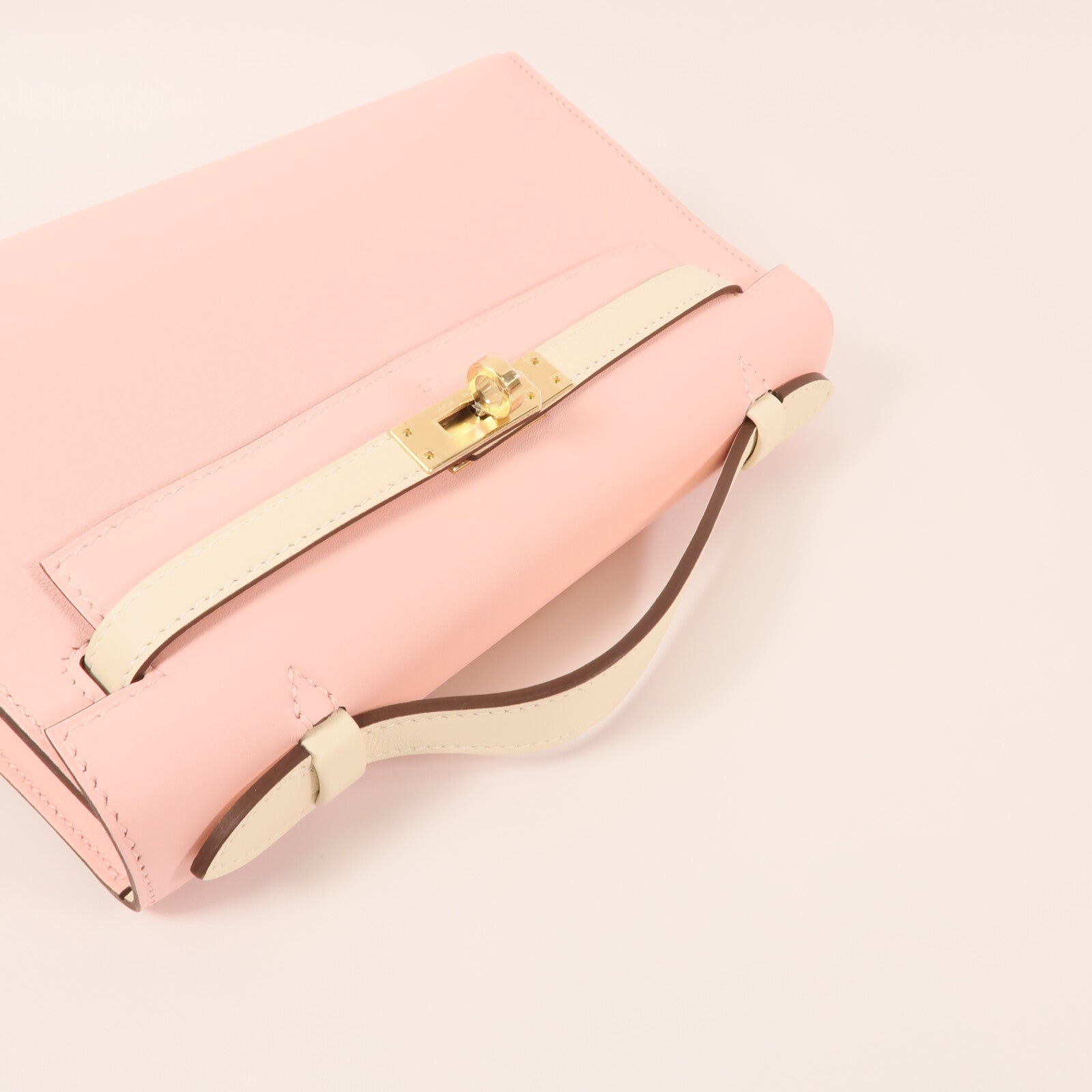 HERMES Swift皮革Mini Kelly Pochette金扣手挽袋Rose Sakura/Nata