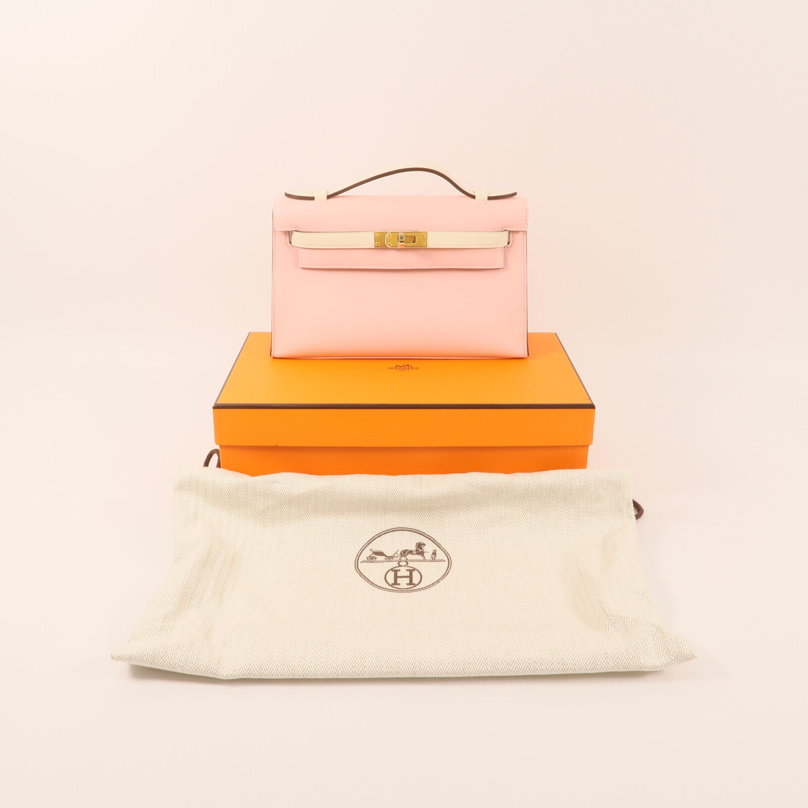 HERMES Swift皮革Mini Kelly Pochette金扣手挽袋Rose Sakura/Nata