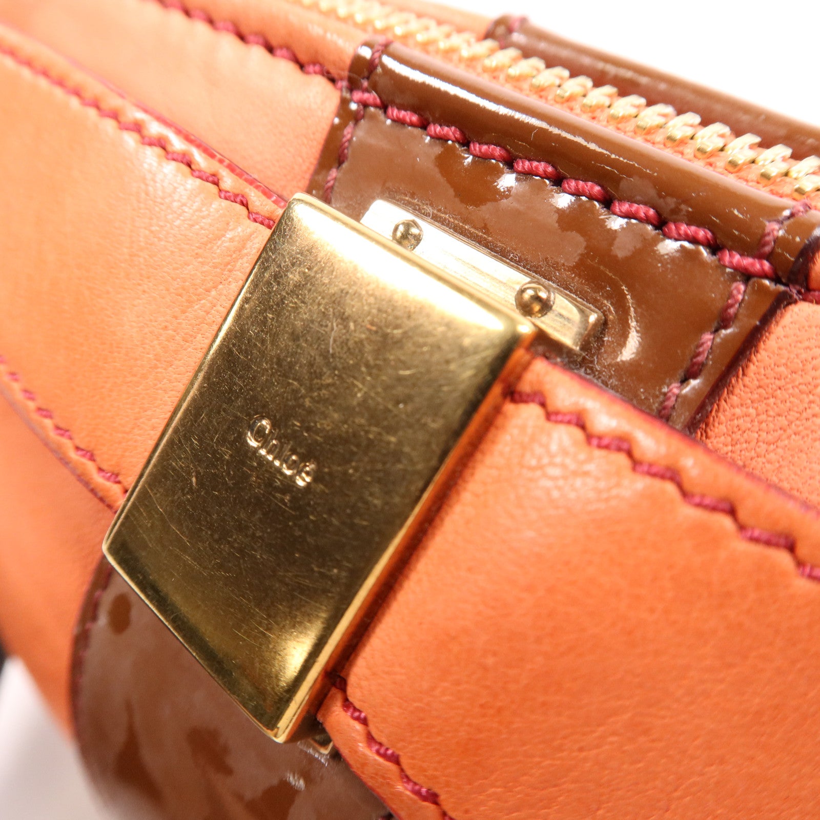 Chloe 羊皮皮革Pouch金扣手拿包