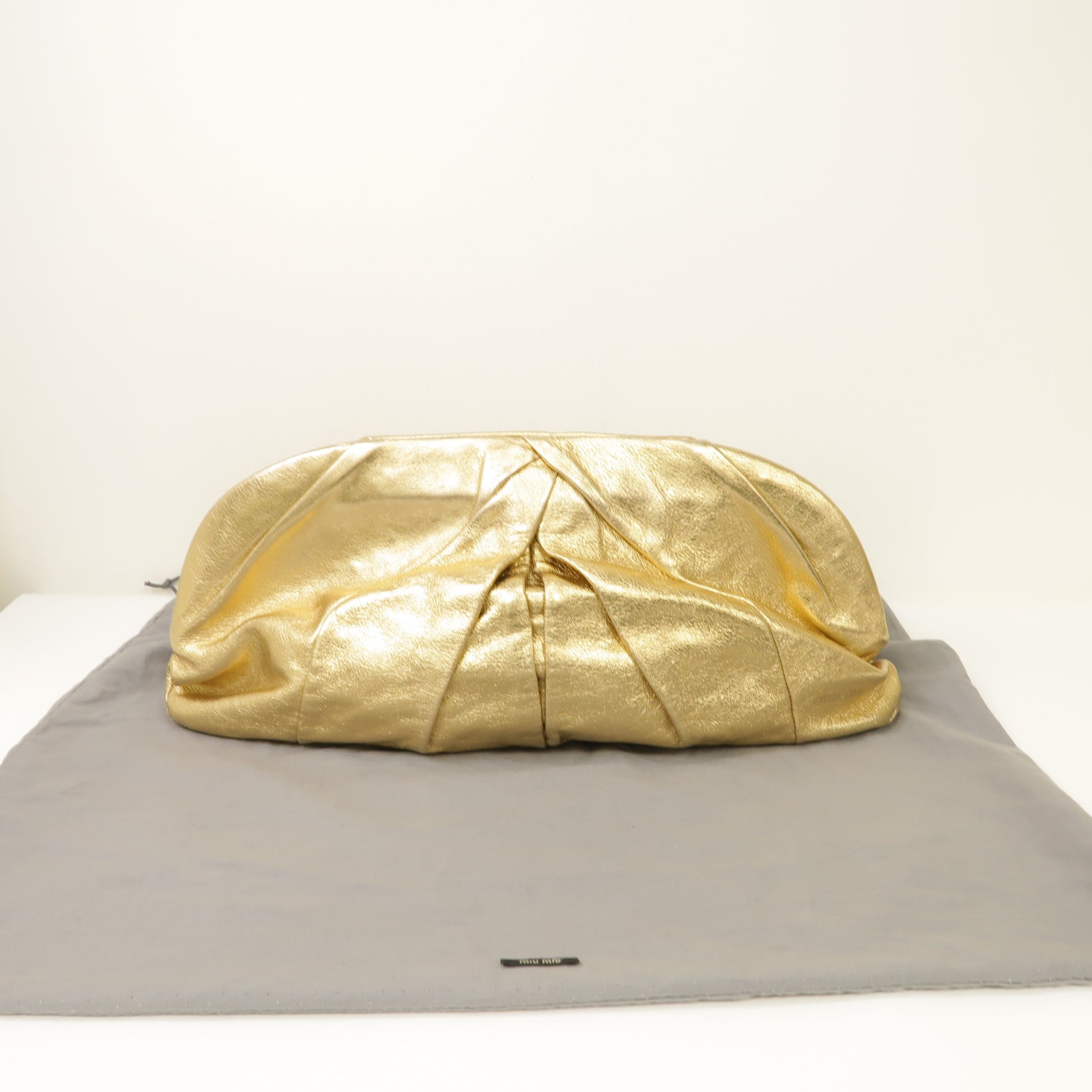 Miu Miu 牛皮皮革Clutch Bag金扣手拿包金色