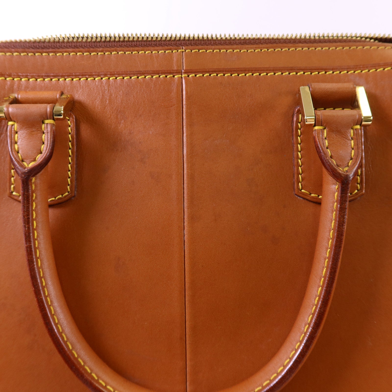 LOUIS VUITTON Nomad皮革Nomad Negev金扣手挽袋
