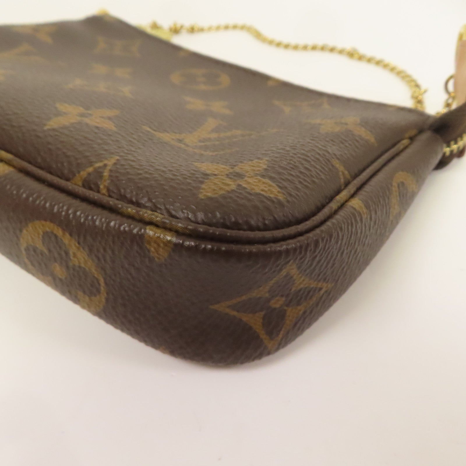 LOUIS VUITTON Monogram Mini Pochette Accessoires金扣手挽袋棕色