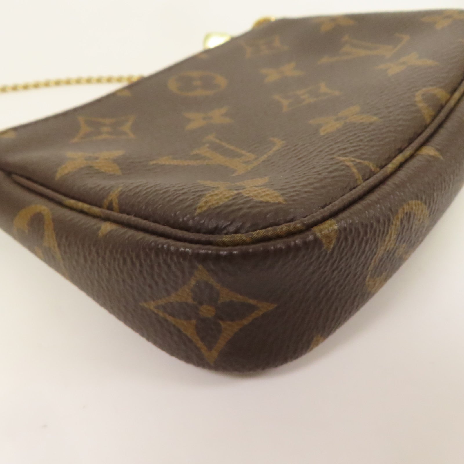 LOUIS VUITTON Monogram Mini Pochette Accessoires金扣手挽袋棕色