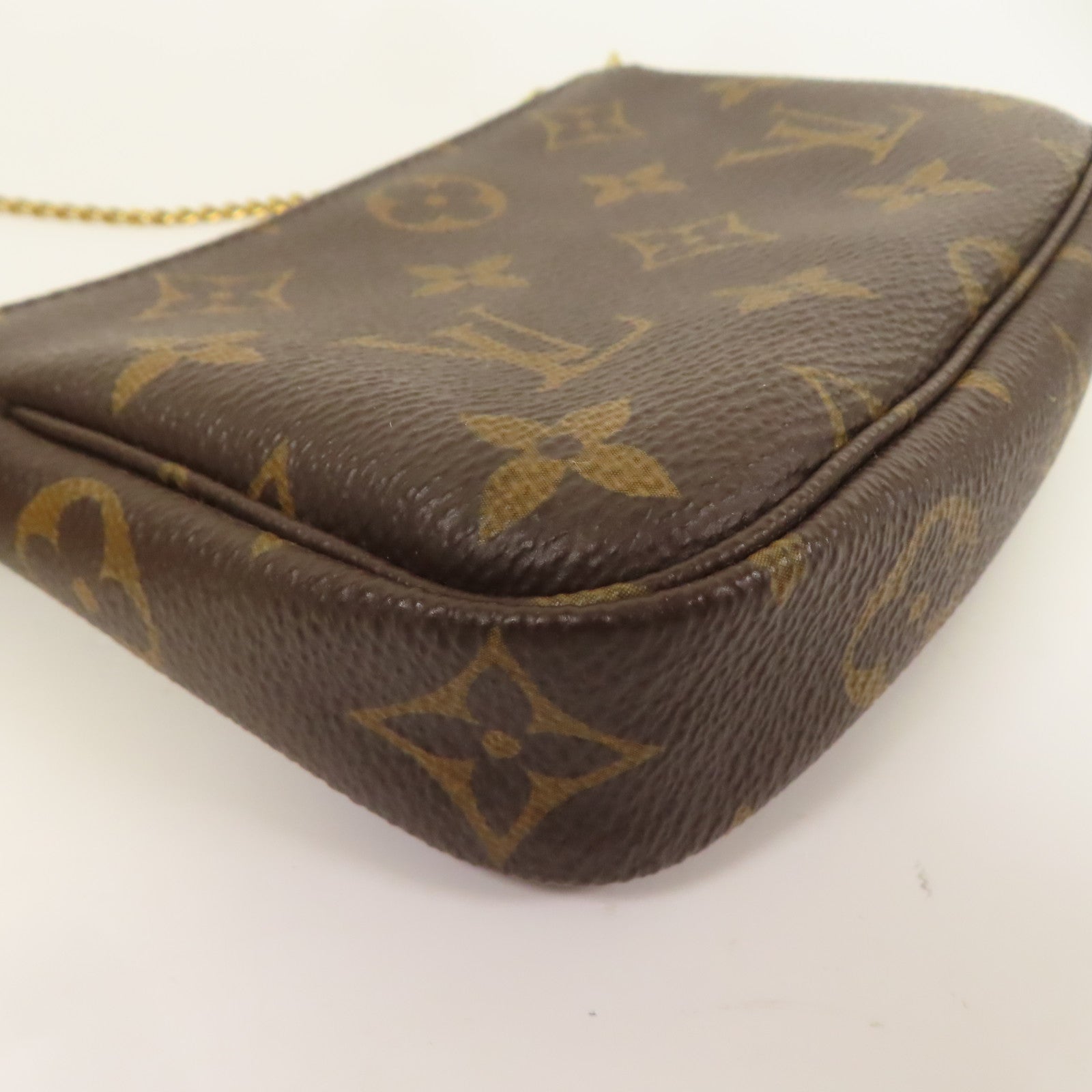 LOUIS VUITTON Monogram Mini Pochette Accessoires金扣手挽袋棕色