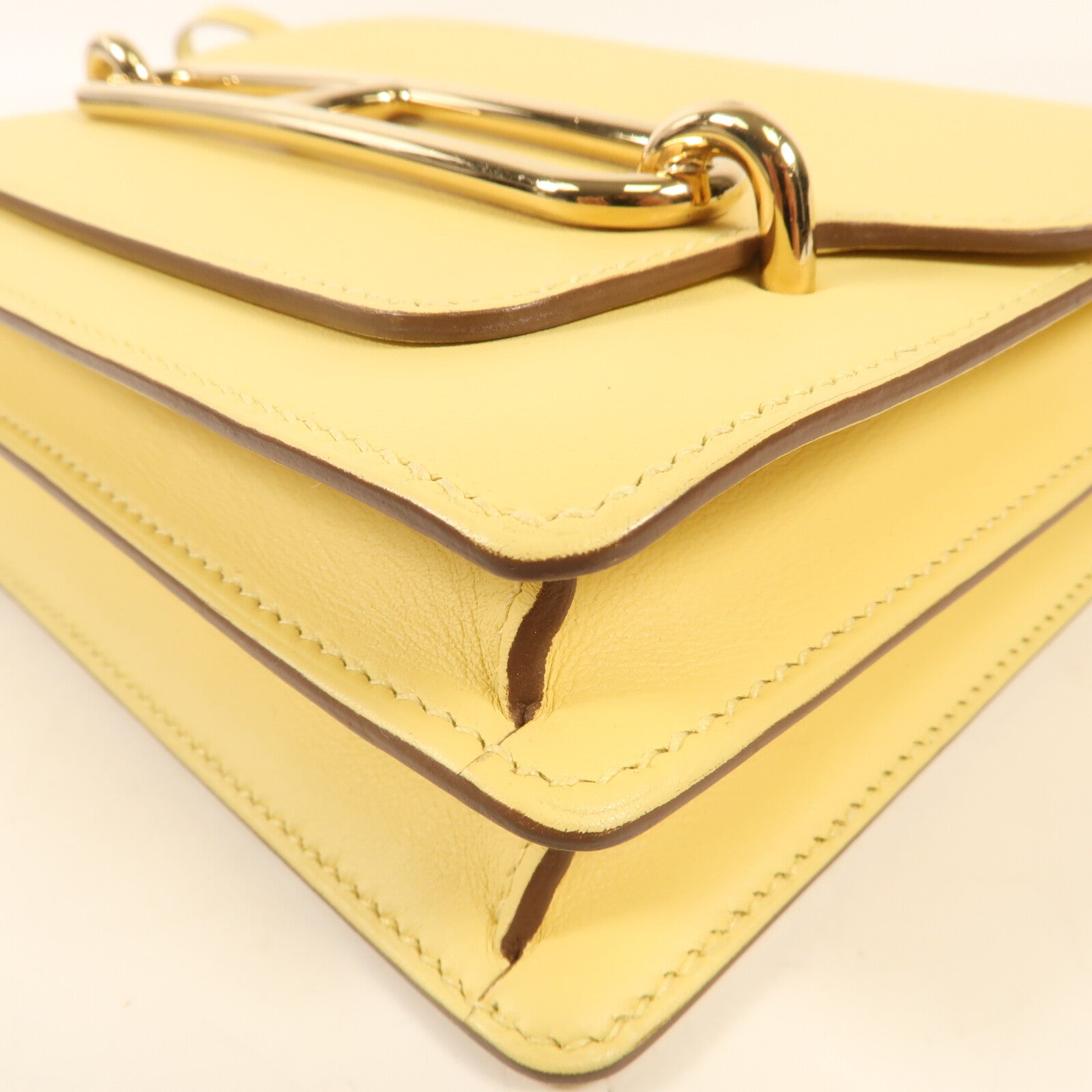 HERMES Swift皮革Mini Roulis金扣肩背袋Jaune Bourgeon