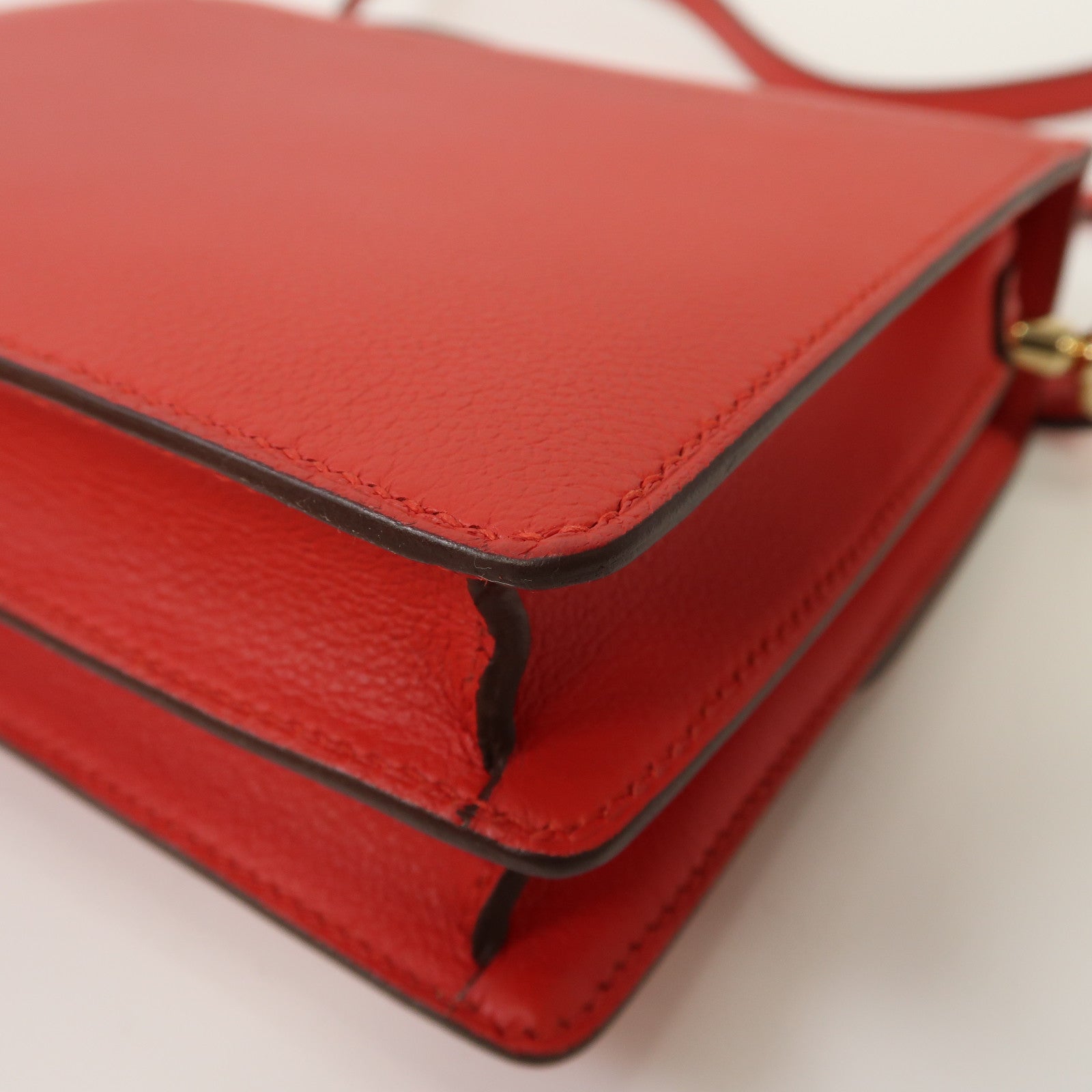 HERMES Evercolor皮革Mini Roulis金扣肩背袋Rouge Casaque法拉利紅