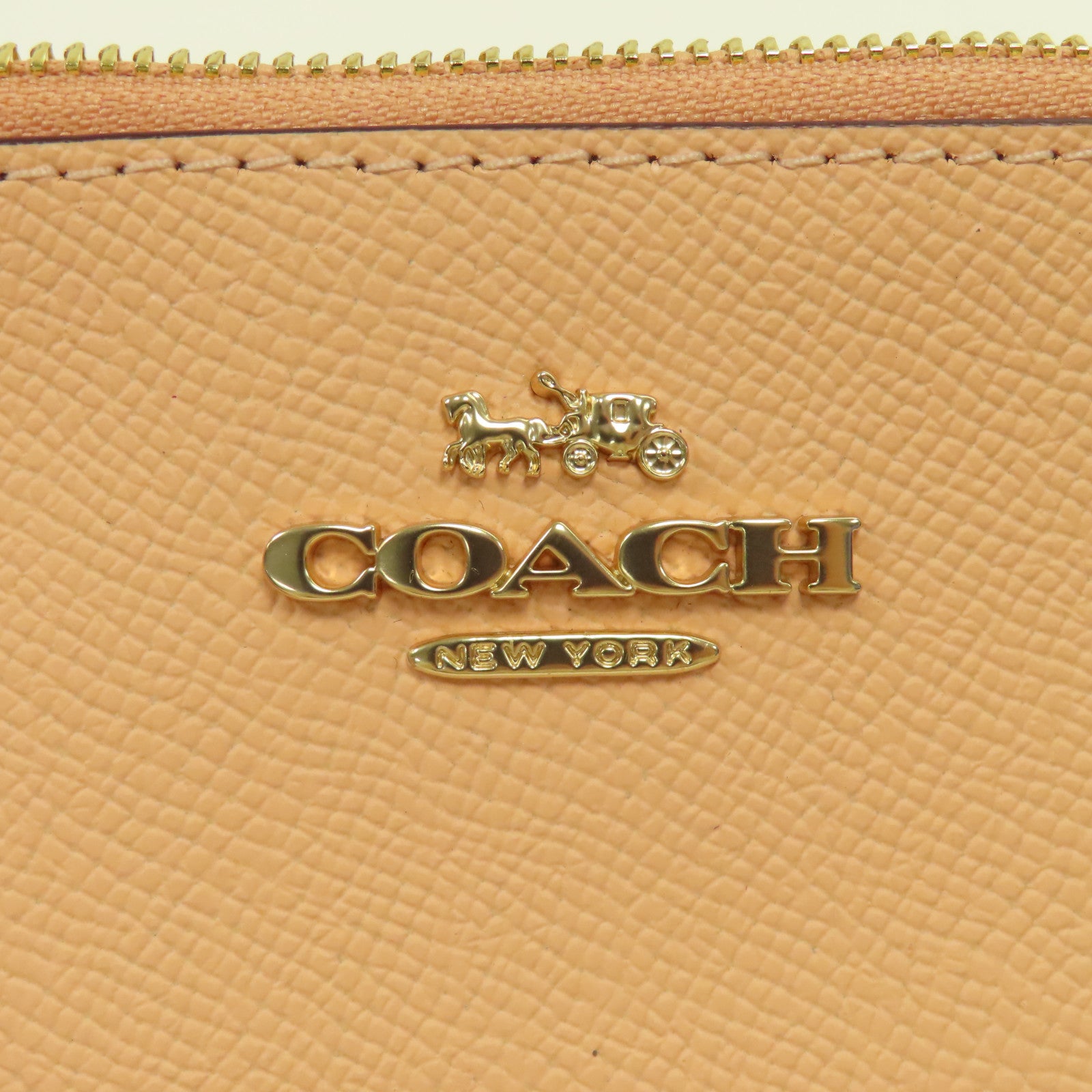 COACH 皮革Pouch金扣手拿包粉紅色