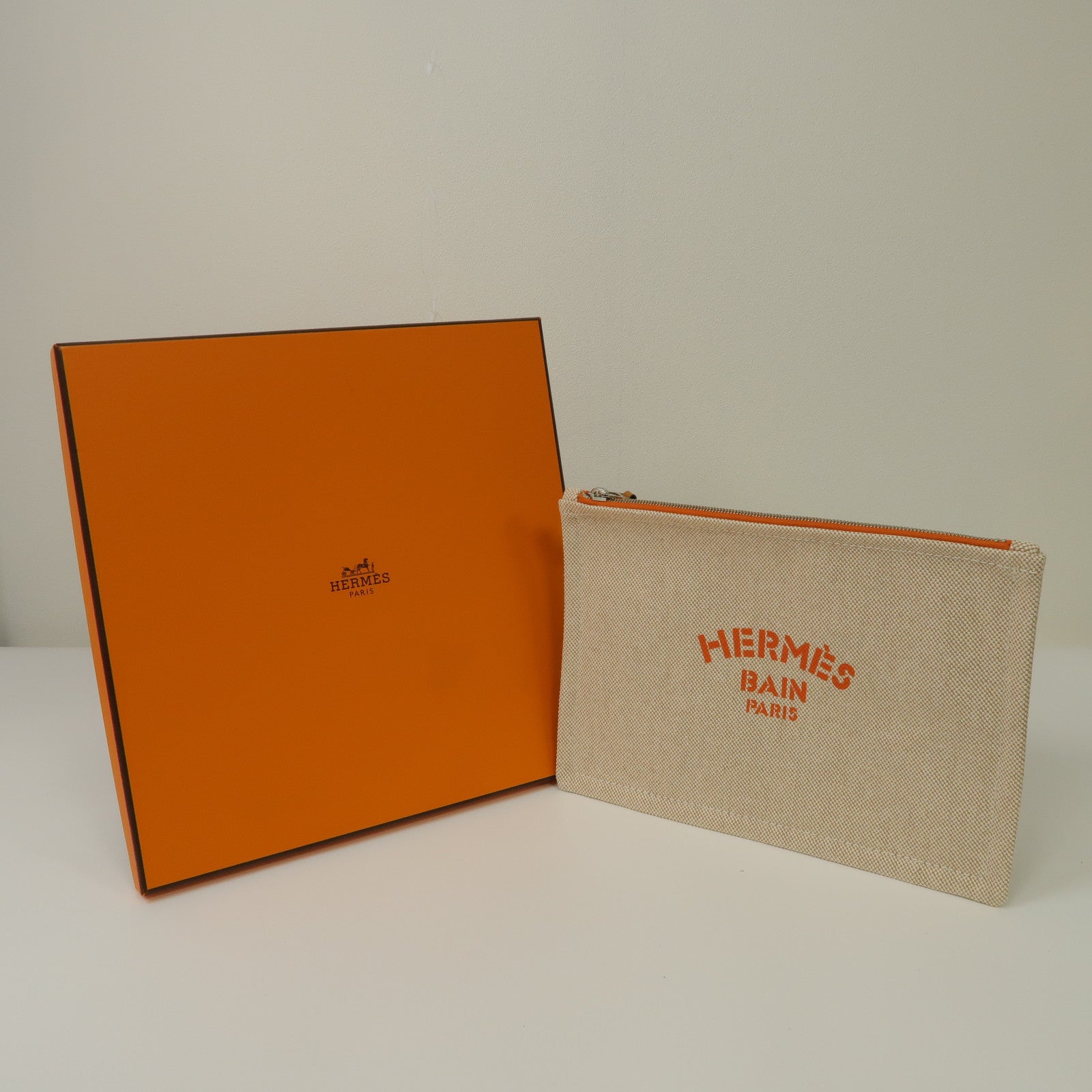 HERMES 帆布Bain銀扣手拿包米色/橙色