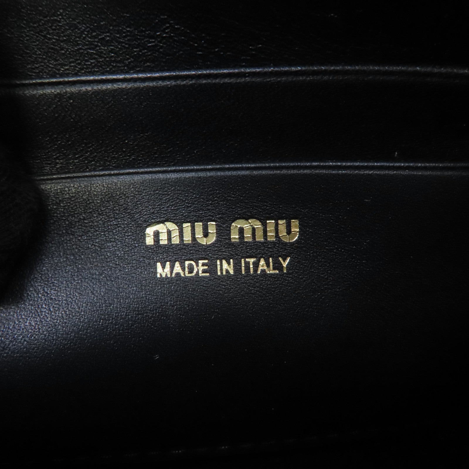 Miu Miu 牛皮皮革Clutch Bag金扣手拿包黑色
