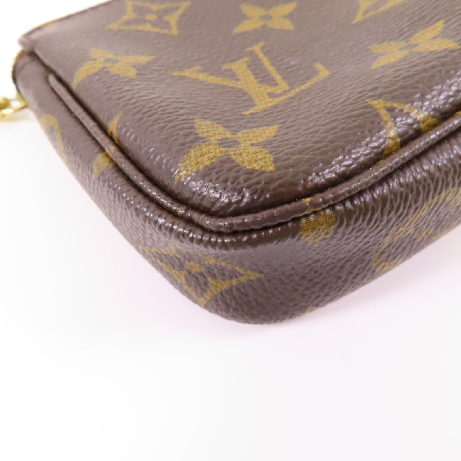 LOUIS VUITTON Monogram Mini Pochette Accessoires金扣手挽袋棕色