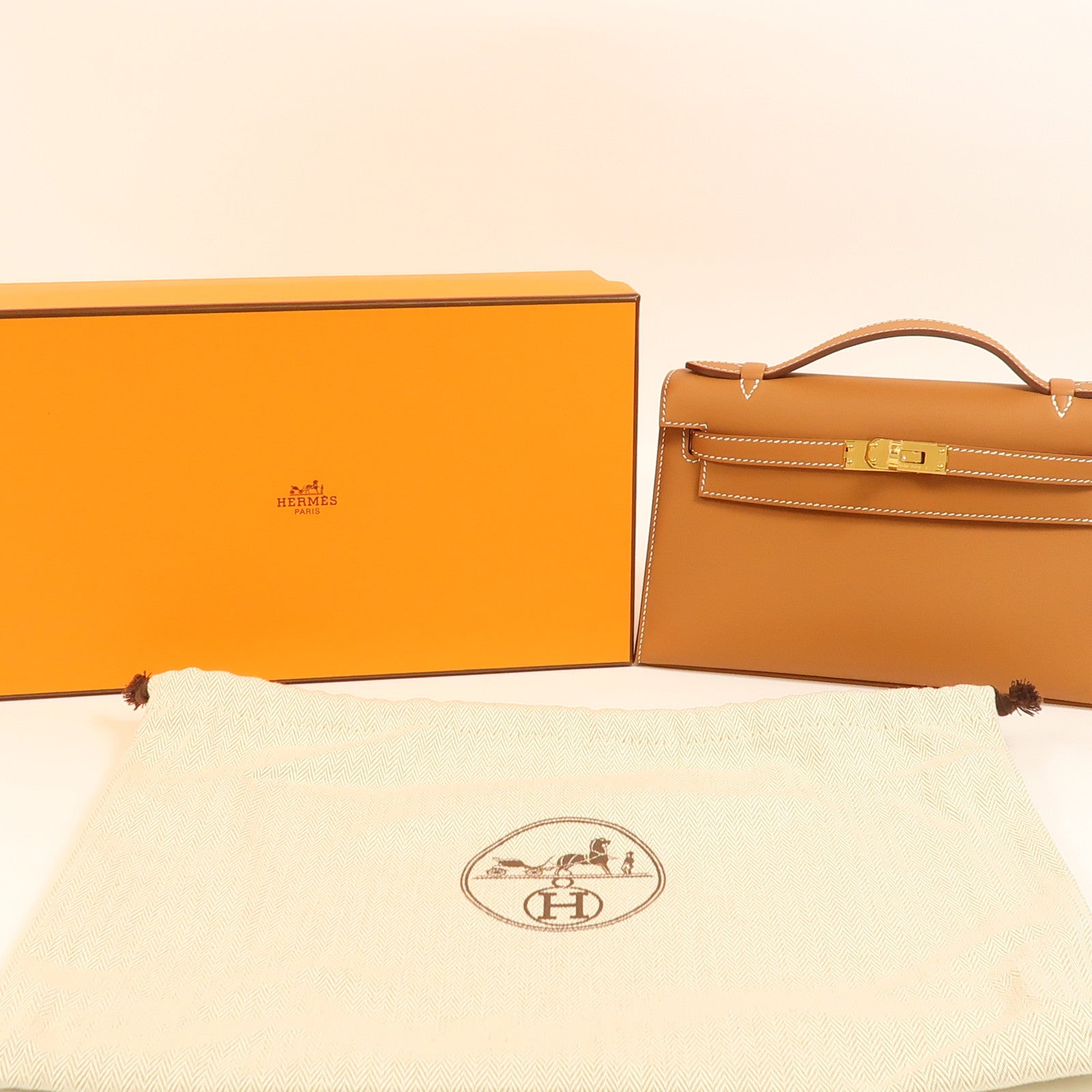 HERMES Swift皮革Kelly Pochette金扣手挽袋