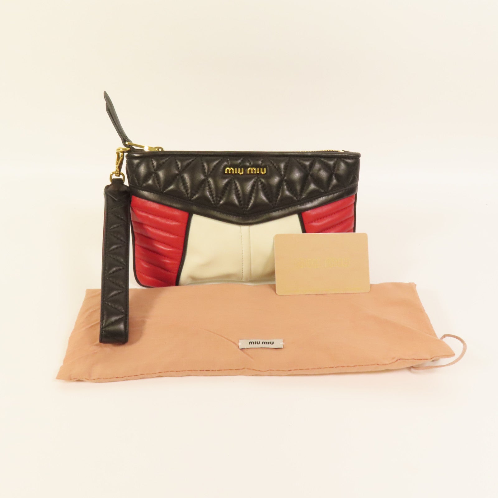 Miu Miu 羊皮皮革Pouch金扣手拿包