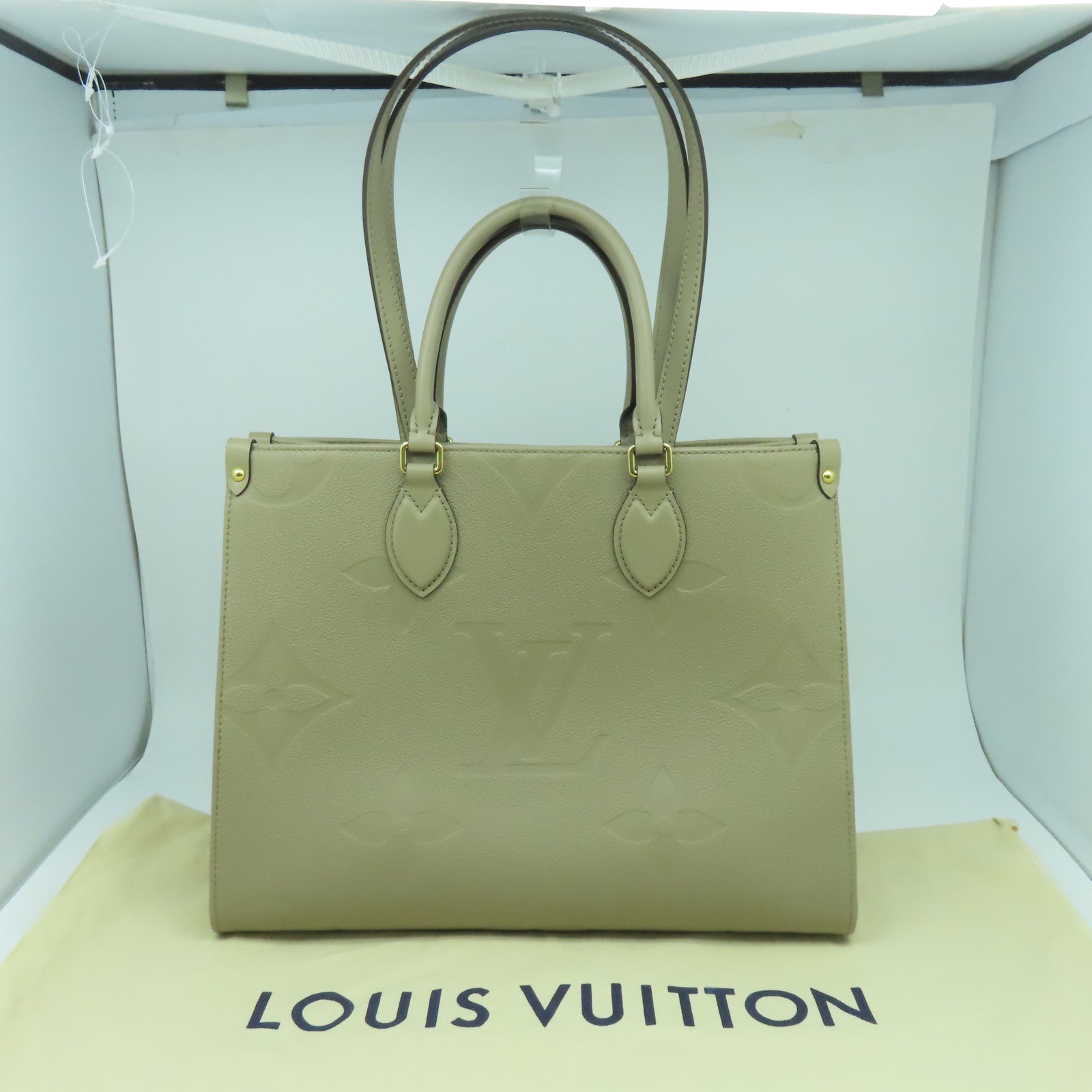 LOUIS VUITTON Monogram Empreinte On The Go MM金扣手挽肩背兩用袋米色