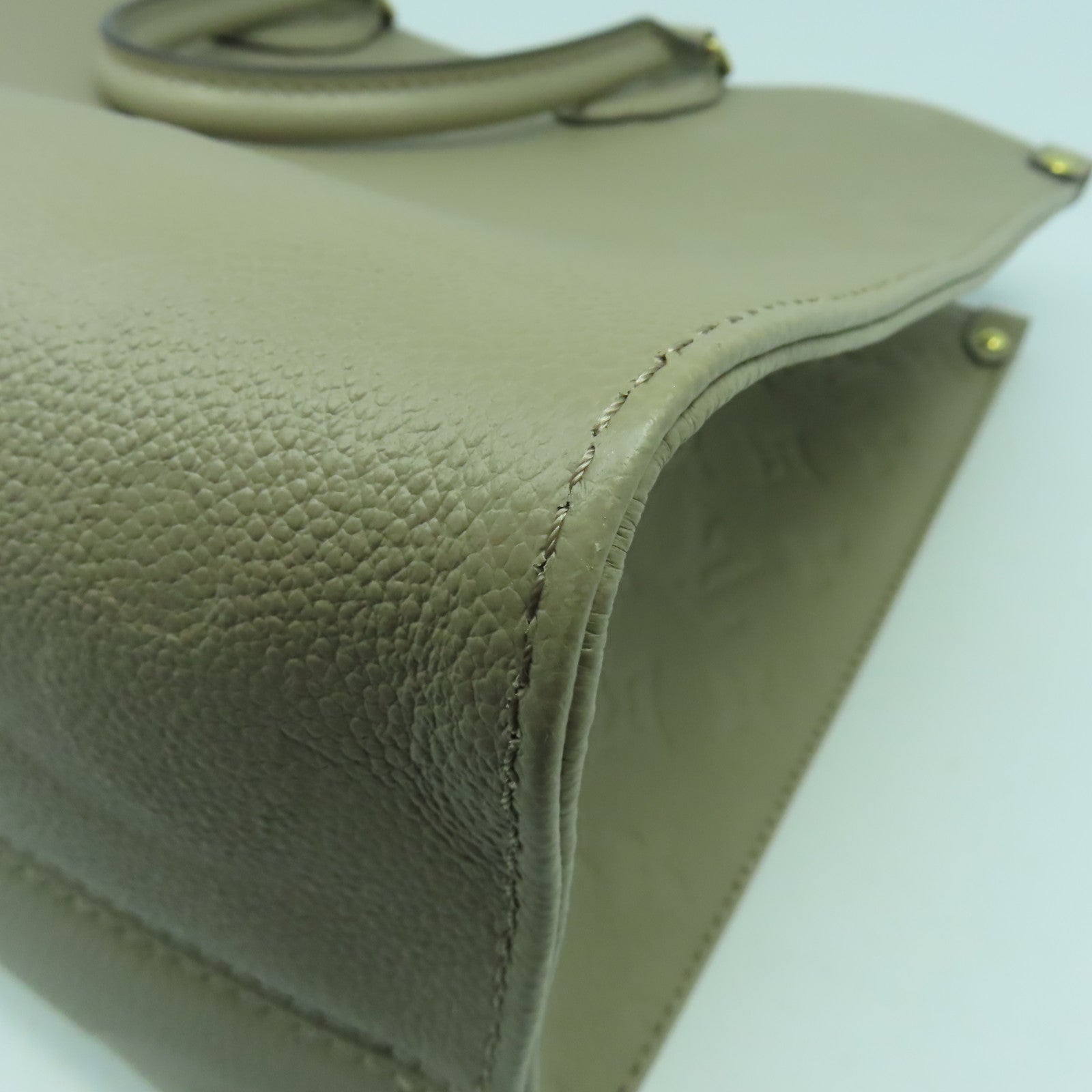 LOUIS VUITTON Monogram Empreinte On The Go MM金扣手挽肩背兩用袋米色