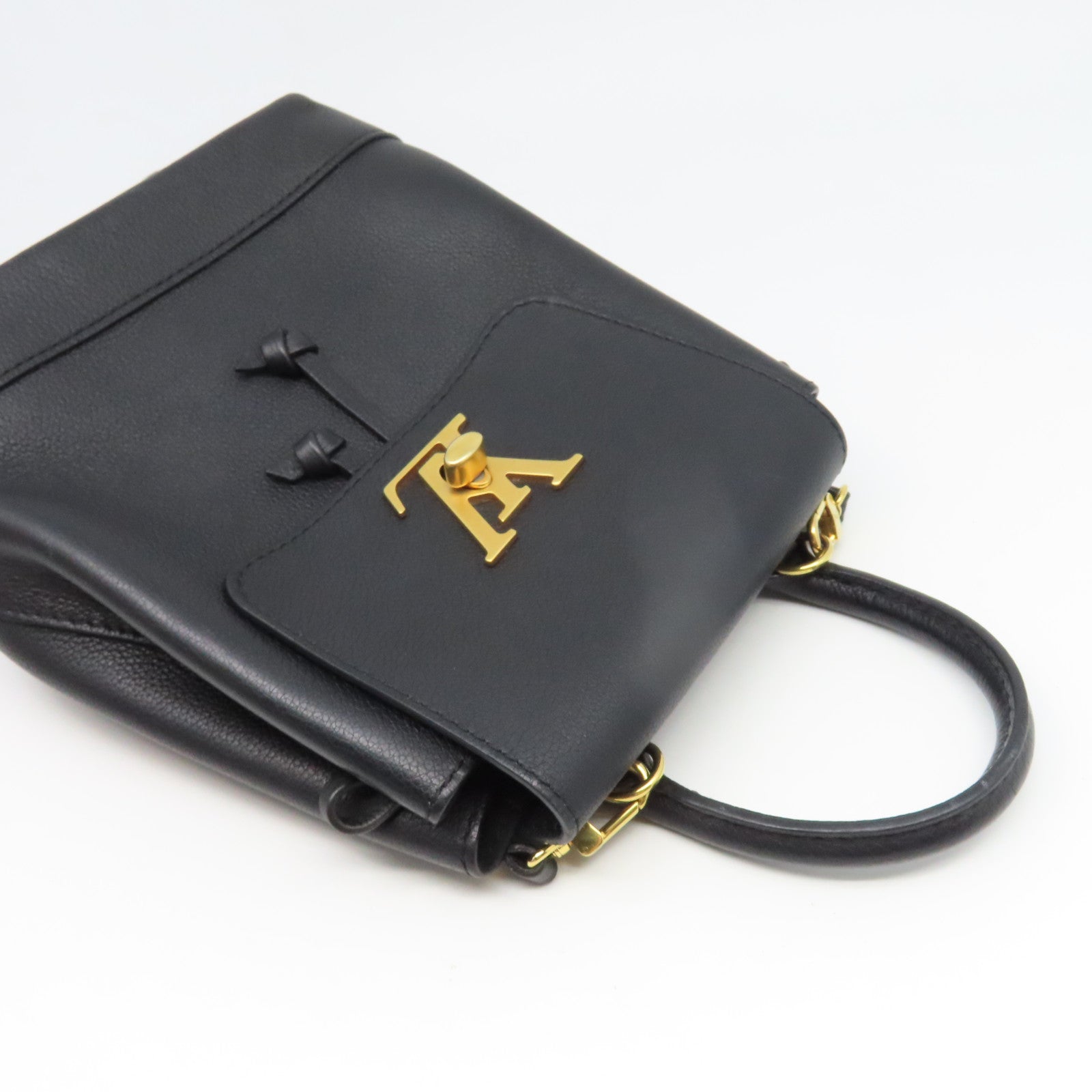 LOUIS VUITTON 牛皮皮革Lock Me Backpack Mini金扣背包黑色