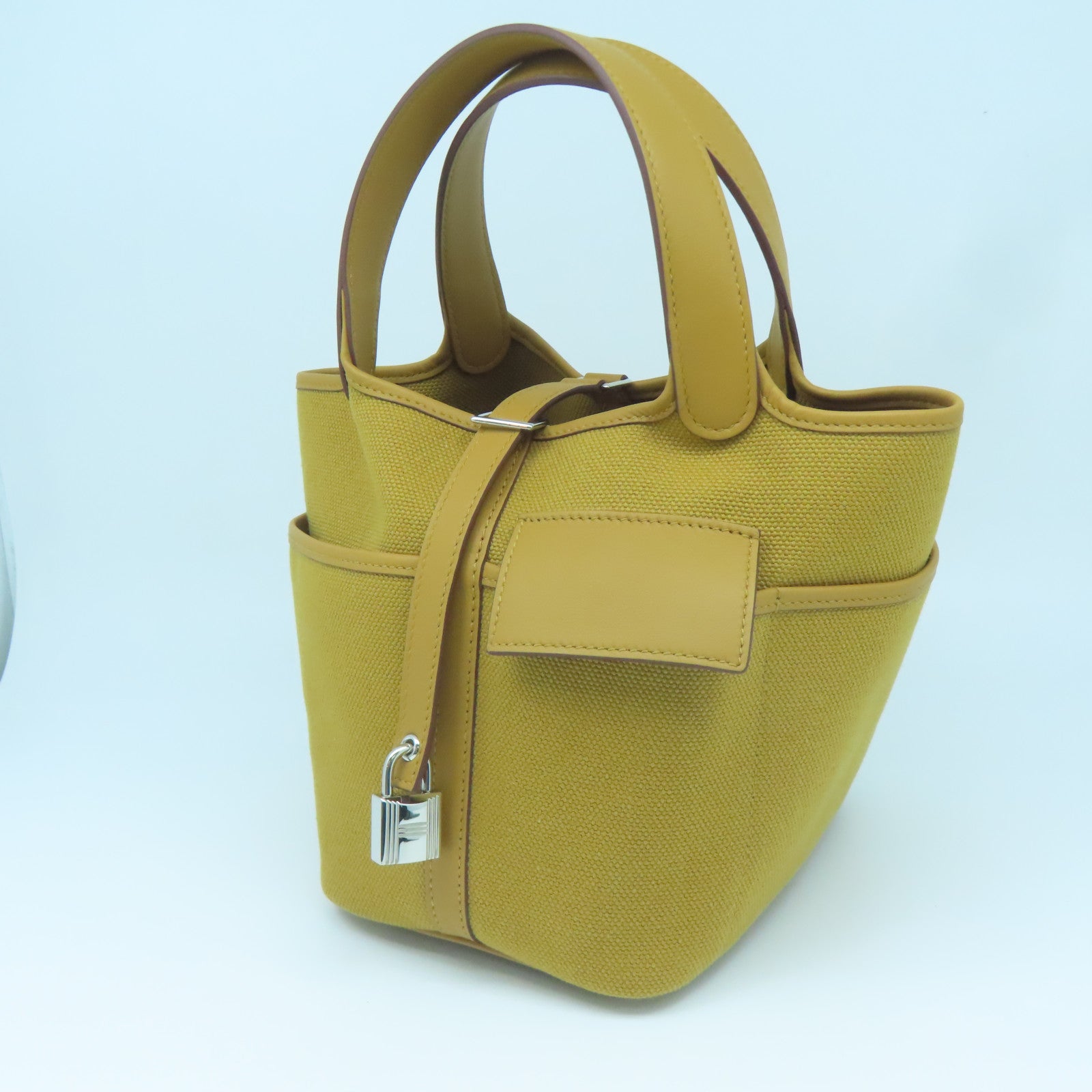 HERMES Swift Leather/Toile Geoland Canvas Picotin Cargo PM Silver Button Handle Bag Sesame