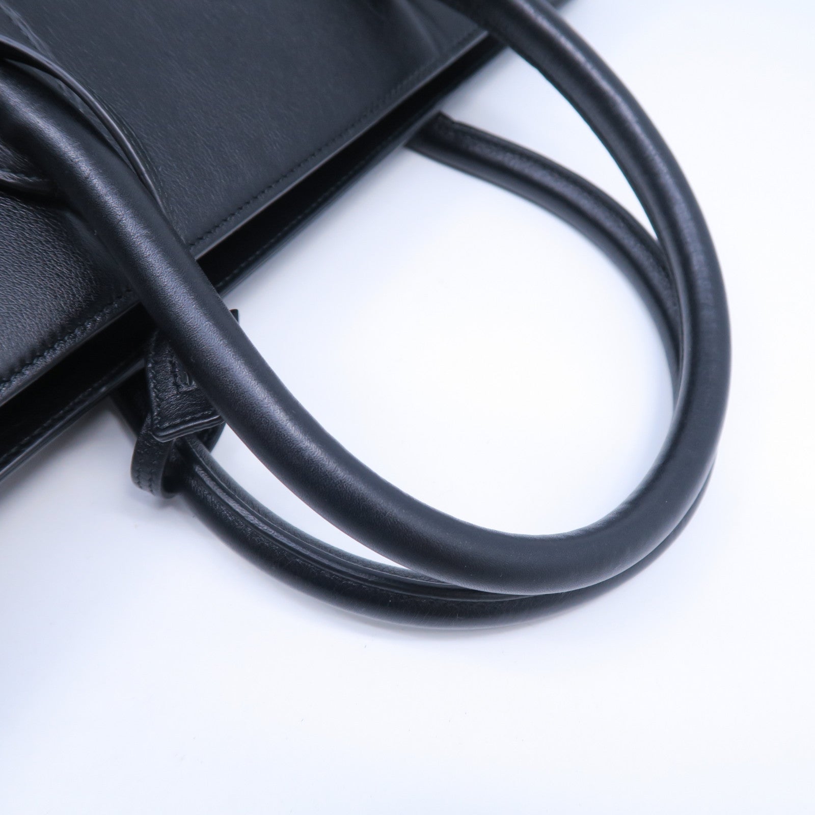 SAINT LAURENT 牛皮皮革Sac De Jou金扣手挽袋黑色