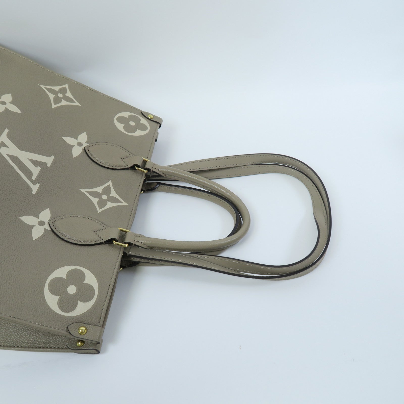 LOUIS VUITTON Monogram Empreinte OnTheGo MM金扣手挽肩背兩用袋斑鳩灰色/奶油色