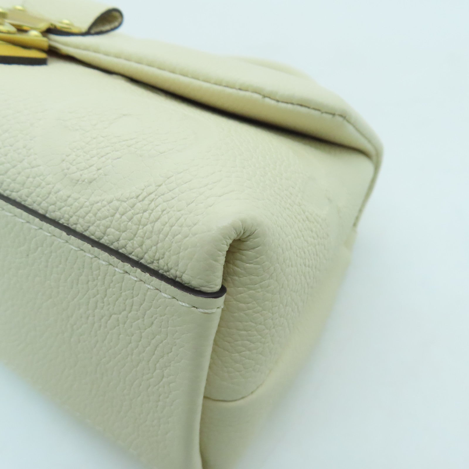 LOUIS VUITTON Monogram Empreinte Madeleine BB gold buckle shoulder shoulder bag white
