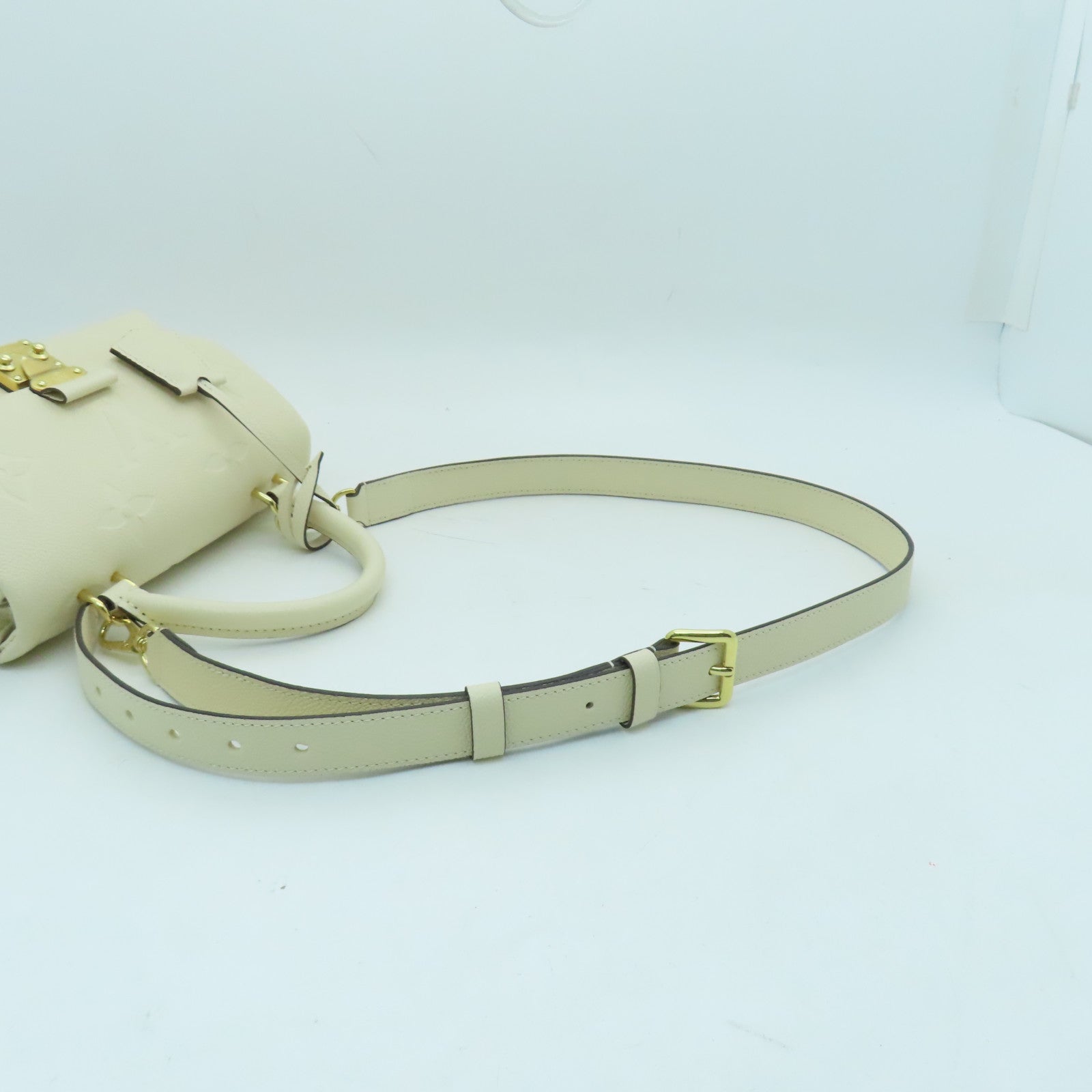 LOUIS VUITTON Monogram Empreinte Madeleine BB gold buckle shoulder shoulder bag white
