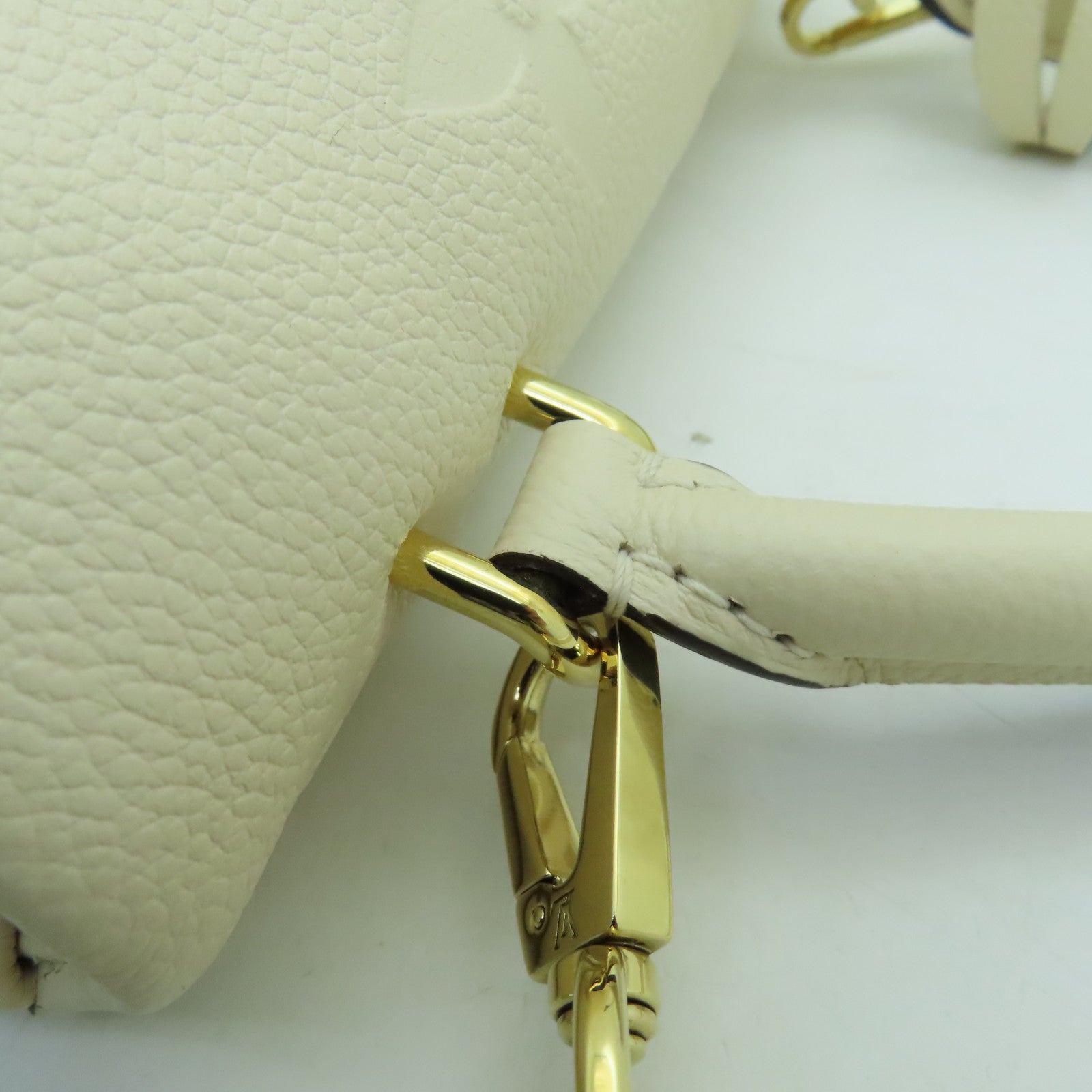LOUIS VUITTON Monogram Empreinte Madeleine BB gold buckle shoulder shoulder bag white