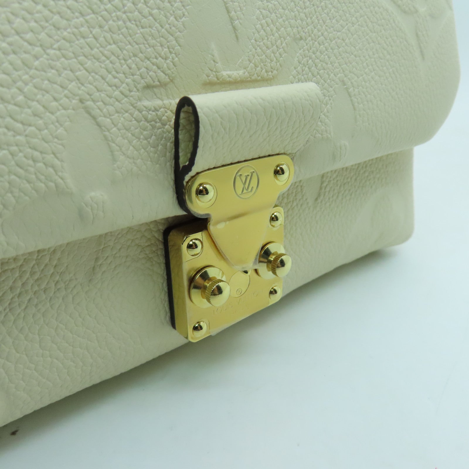 LOUIS VUITTON Monogram Empreinte Madeleine BB gold buckle shoulder shoulder bag white