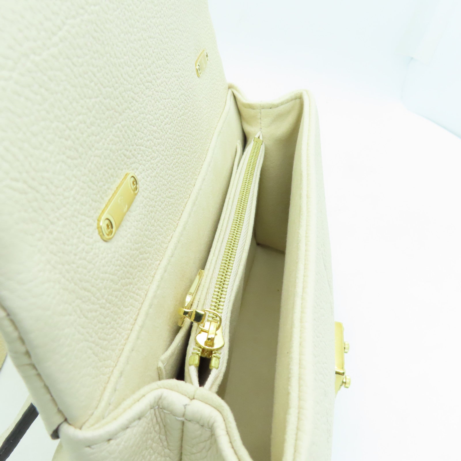 LOUIS VUITTON Monogram Empreinte Madeleine BB gold buckle shoulder shoulder bag white