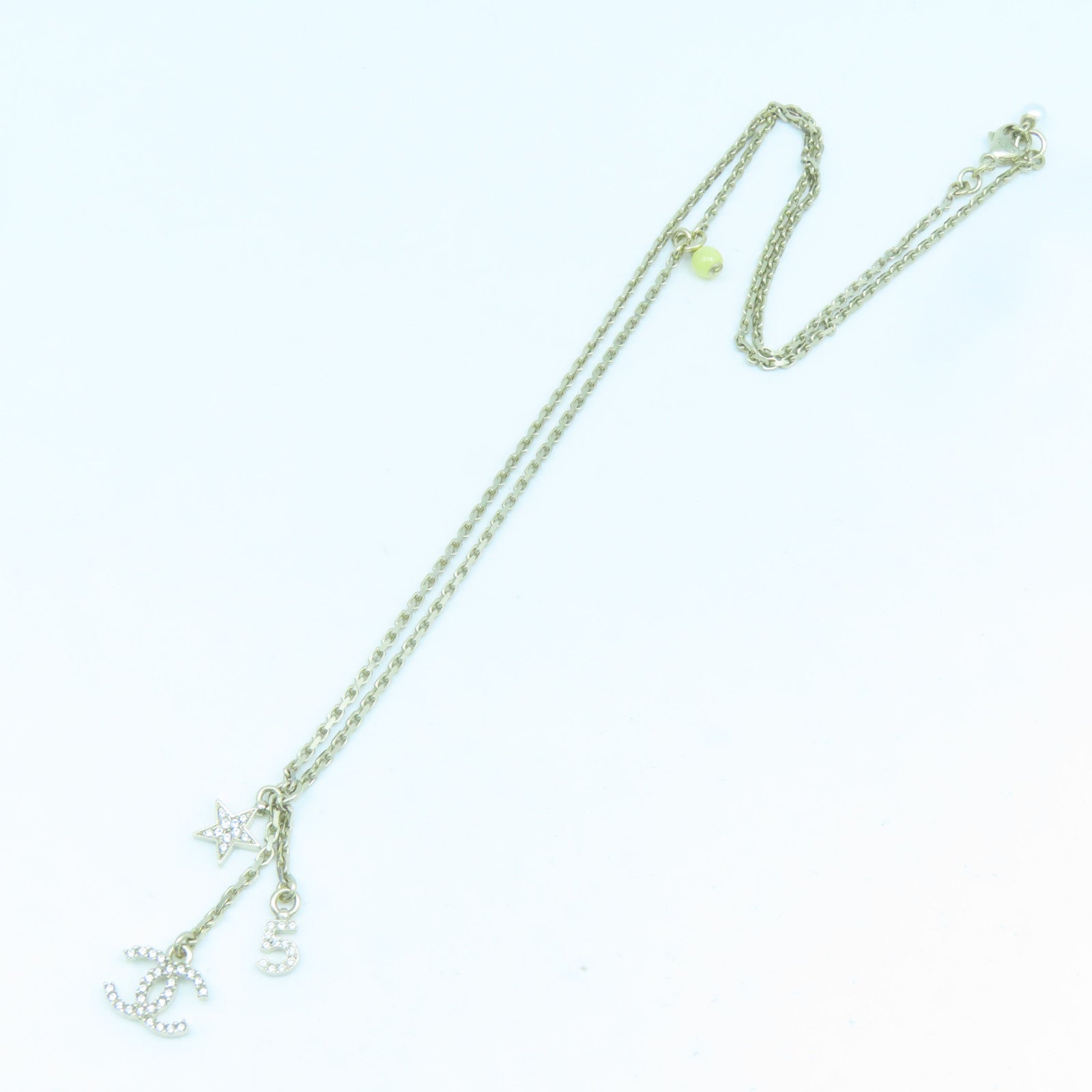 CHANEL Metal Logo No.5 Star Necklace Gold