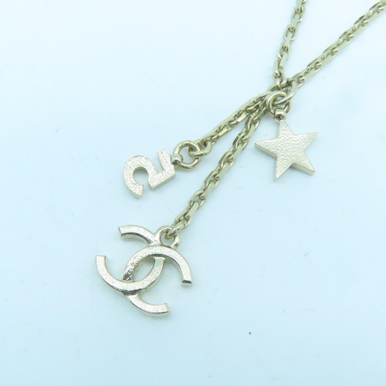 CHANEL Metal Logo No.5 Star Necklace Gold