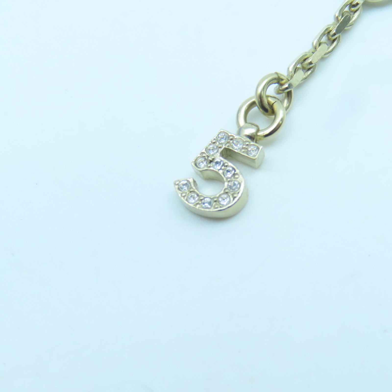 CHANEL Metal Logo No.5 Star Necklace Gold